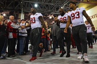 PHOENIX, AZ - JANUARY 09:  defensive lineman Jarran Reed #90, defensive lineman A'Shawn Robinson #86 and defensive lineman Jonathan Allen #93 of the Alabama Crimson Tide enter Media Day for the College Football Playoff National Championship at Phoenix Con