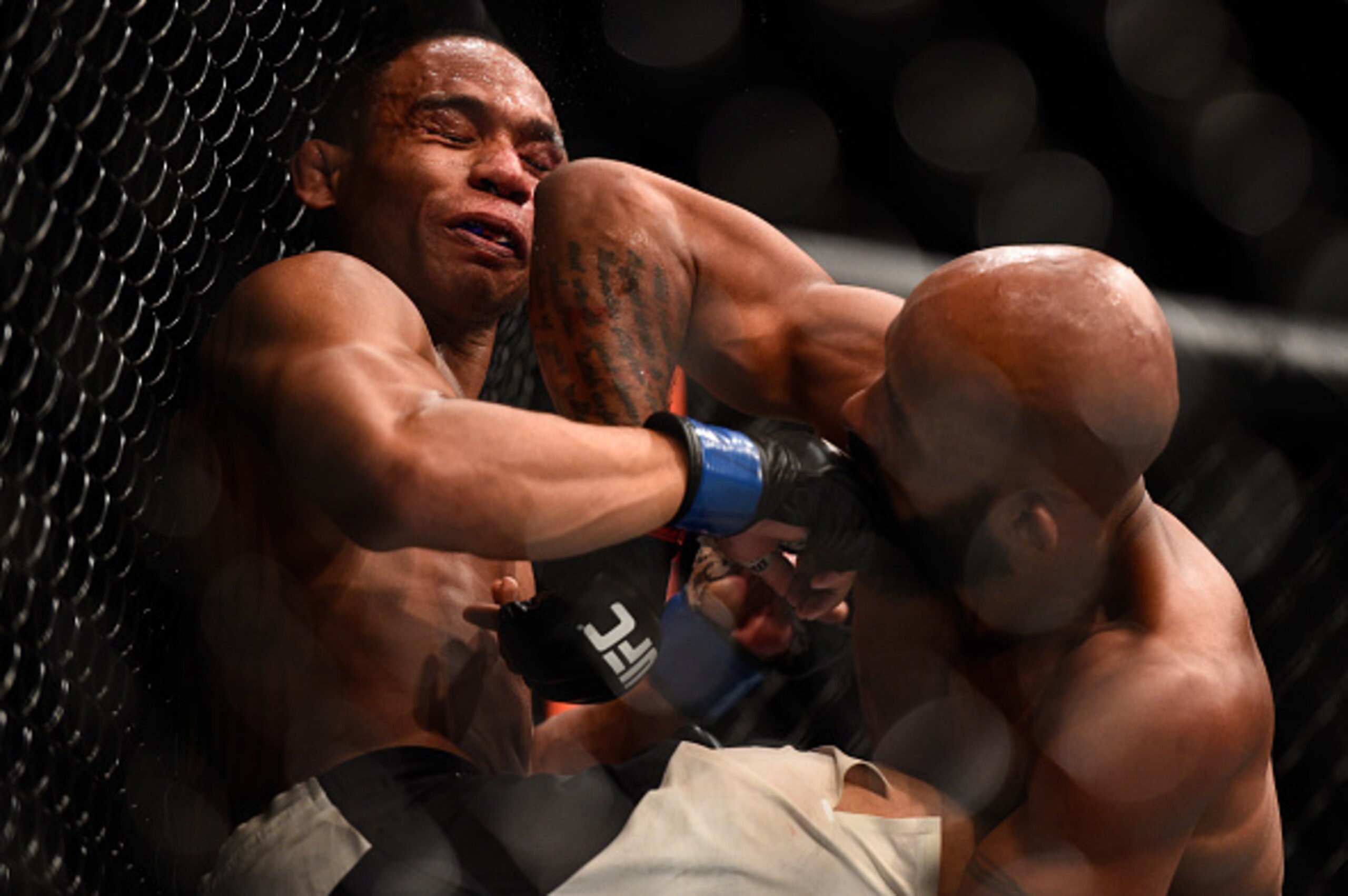 LAS VEGAS, NV - SEPTEMBER 05: (R-L) Demetrious Johnson elbows John Dodson in their flyweight championship bout during the UFC 191 event inside MGM Grand Garden Arena on September 5, 2015 in Las Vegas, Nevada.  (Photo by Jeff Bottari/Zuffa LLC/Zuffa LLC vi