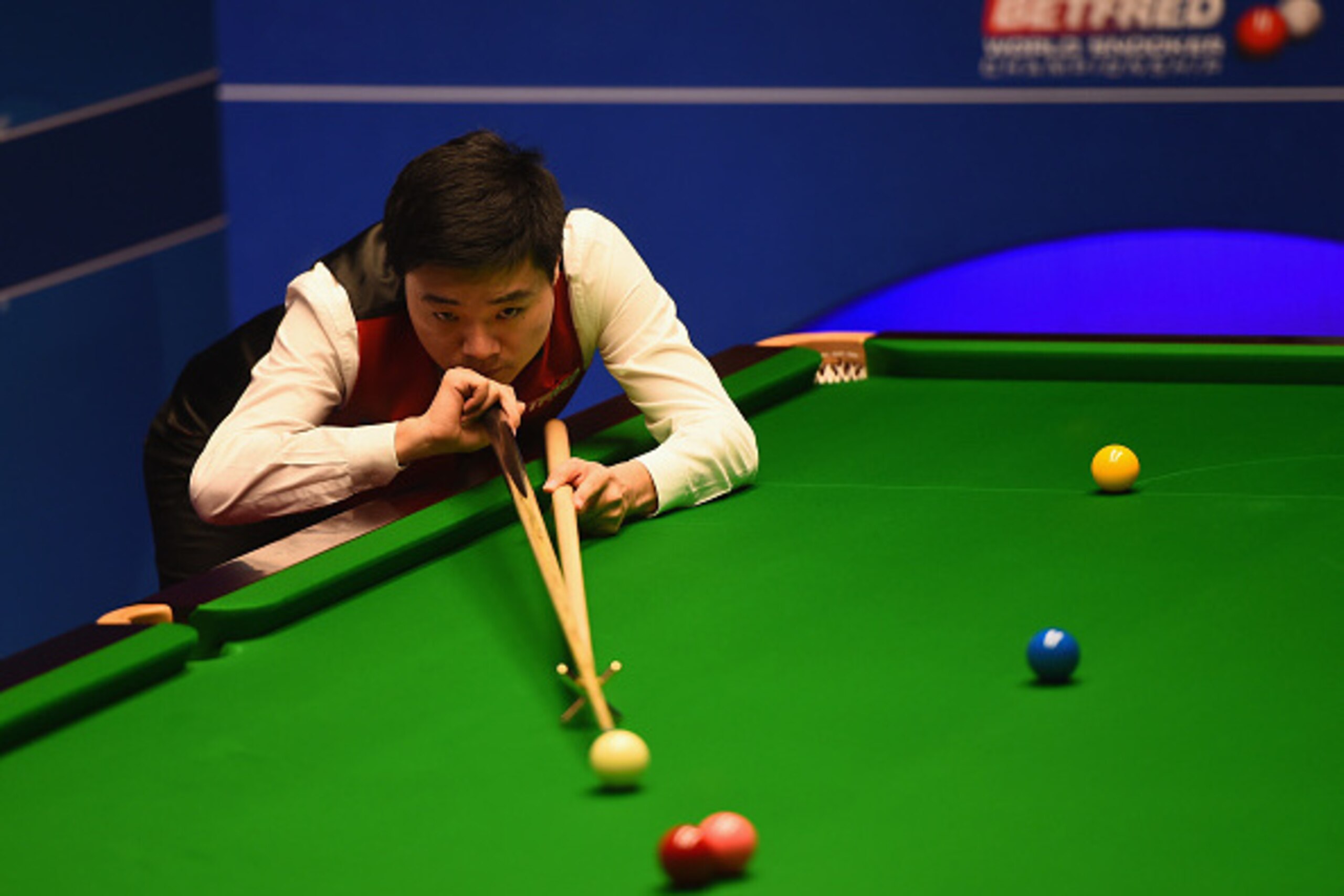 SHEFFIELD, ENGLAND - APRIL 26:  Ding Junhui of China in action during his quarter final match against  Mark Williams of Wales on day eleven of the World Championship Snooker at Crucible Theatre on April 26, 2016 in Sheffield, England.  (Photo by Laurence 