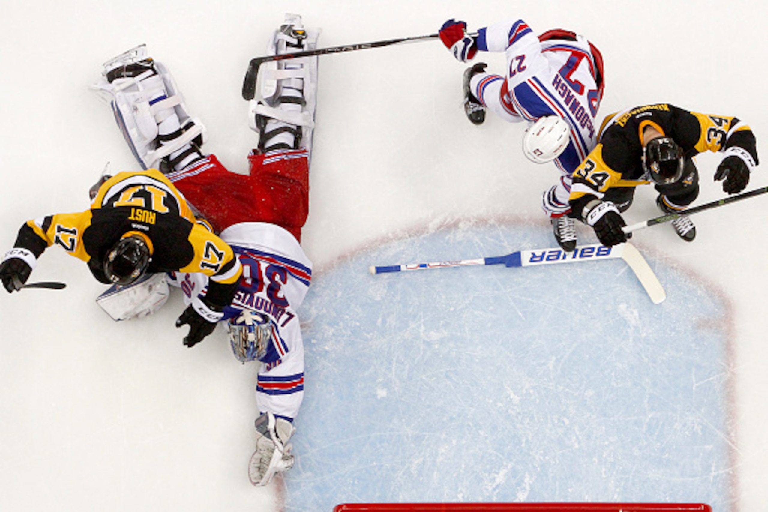 PITTSBURGH, PA - APRIL 23:  Bryan Rust #17 of the Pittsburgh Penguins celebrates after scoring in the second period against Henrik Lundqvist #30 of the New York Rangers in Game Five of the Eastern Conference First Round during the 2016 NHL Stanley Cup Pla