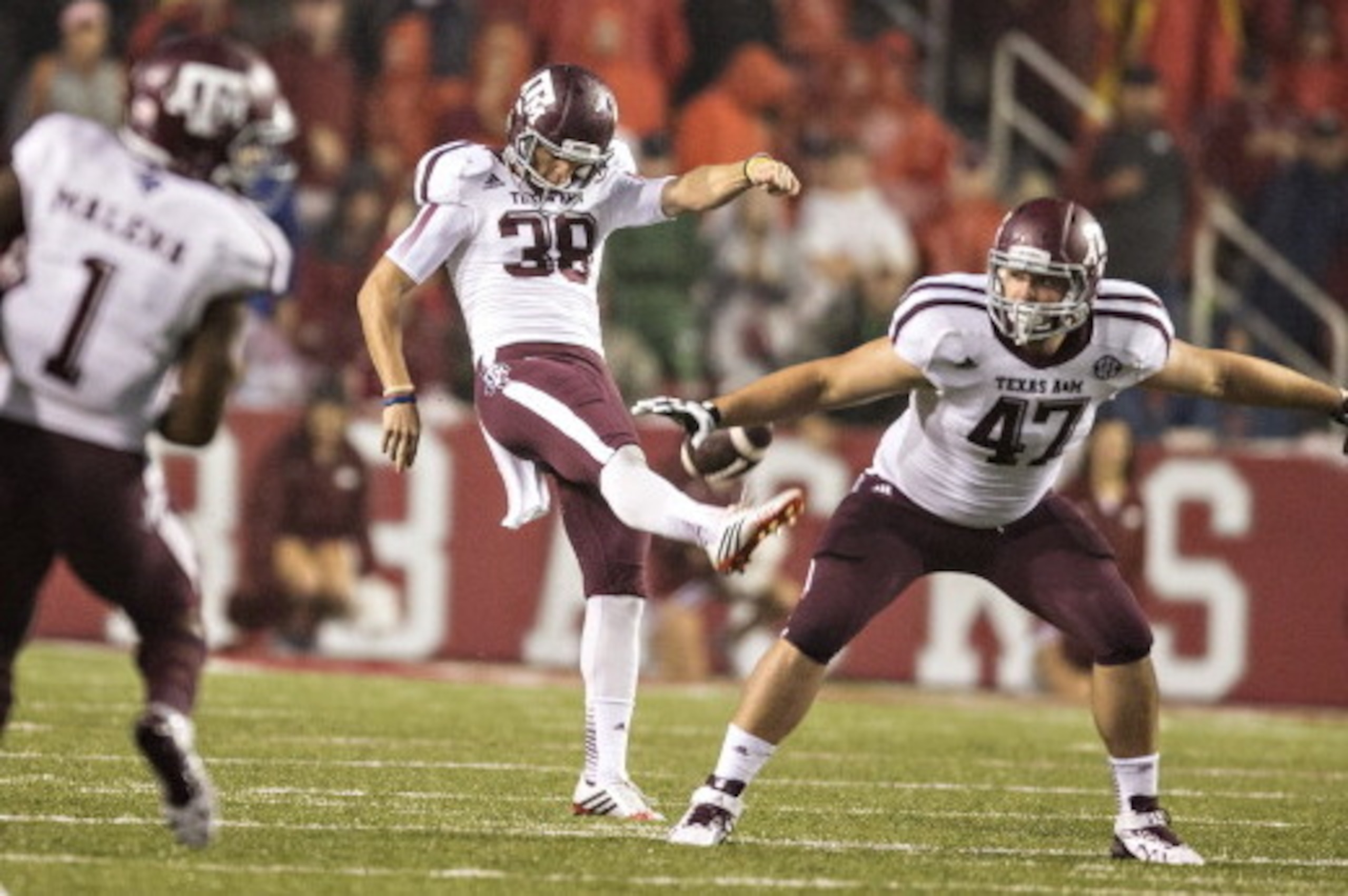 FAYETTEVILLE, AR - SEPTEMBER 28: Drew Kaser #38 of the Texas A&M Aggies punts the ball against the Arkansas Razorbacks at Razorback Stadium on September 28, 2013 in Fayetteville, Arkansas. The Aggies defeated the Razorbacks 45-33. (Photo by Wesley Hitt FAYETTEVILLE, AR - SEPTEMBER 28: Drew Kaser #38 of the Texas A&M Aggies punts the ball against the Arkansas Razorbacks at Razorback Stadium on September 28, 2013 in Fayetteville, Arkansas. The Aggies defeated the Razorbacks 45-33. (Photo by Wesley Hitt