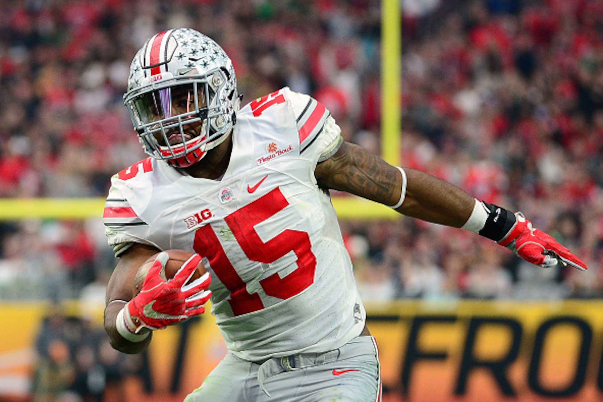 GLENDALE, AZ - JANUARY 01:  Running back Ezekiel Elliott #15 of the Ohio State Buckeyes runs up field during the first half of the BattleFrog Fiesta Bowl against the Notre Dame Fighting Irish at University of Phoenix Stadium on January 1, 2016 in Glendale