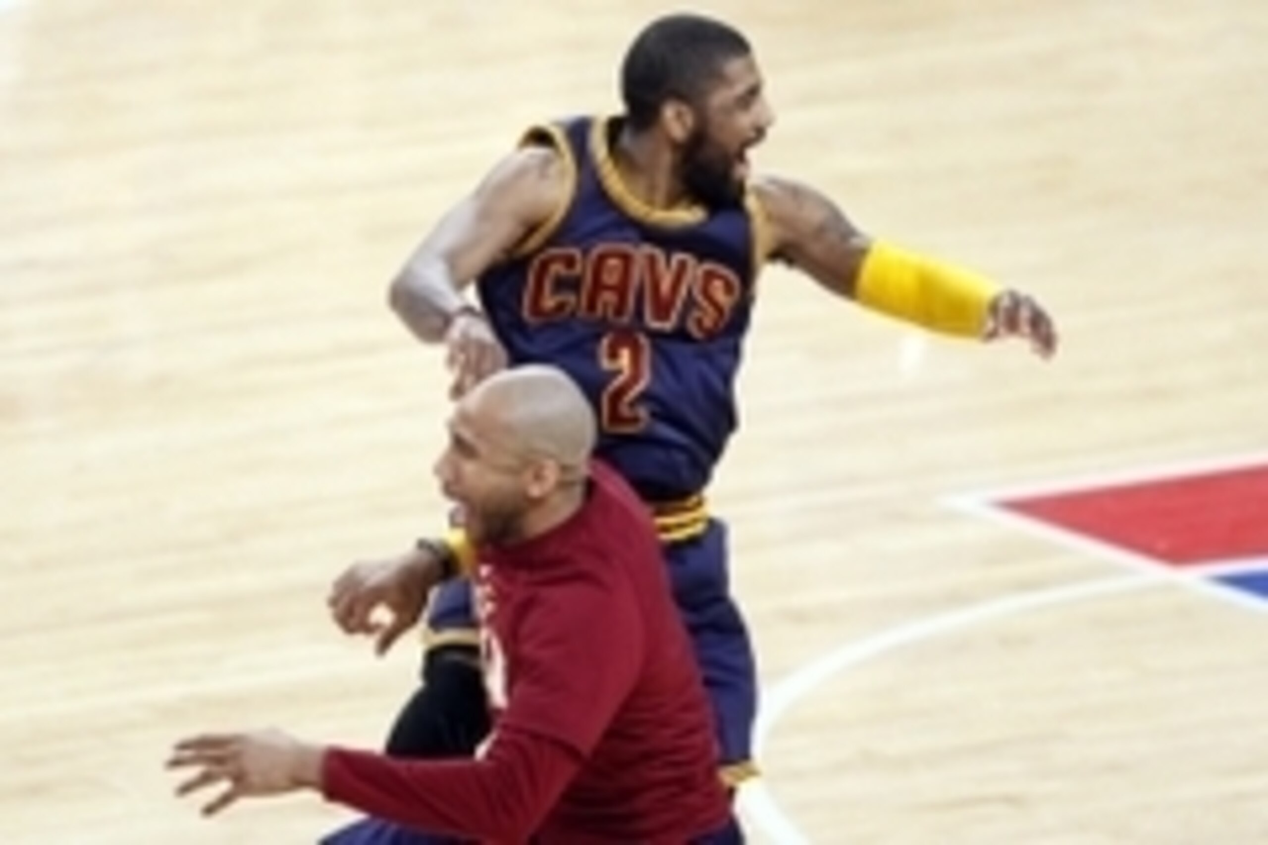 Apr 24, 2016; Auburn Hills, MI, USA; Cleveland Cavaliers guard Kyrie Irving (2) celebrates with guard Dahntay Jones (30) just after the third quarter against the Detroit Pistons in game four of the first round of the NBA Playoffs at The Palace of Auburn H