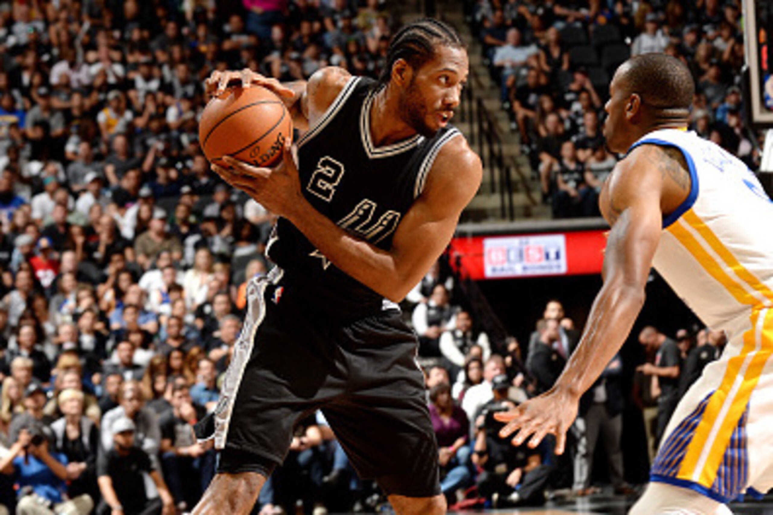 SAN ANTONIO, TX - APRIL 10: Kawhi Leonard #2 of the San Antonio Spurs handles the ball during the game against the Golden State Warriors on April 10, 2016 at the AT&T Center in San Antonio, Texas. NOTE TO USER: User expressly acknowledges and agrees that,