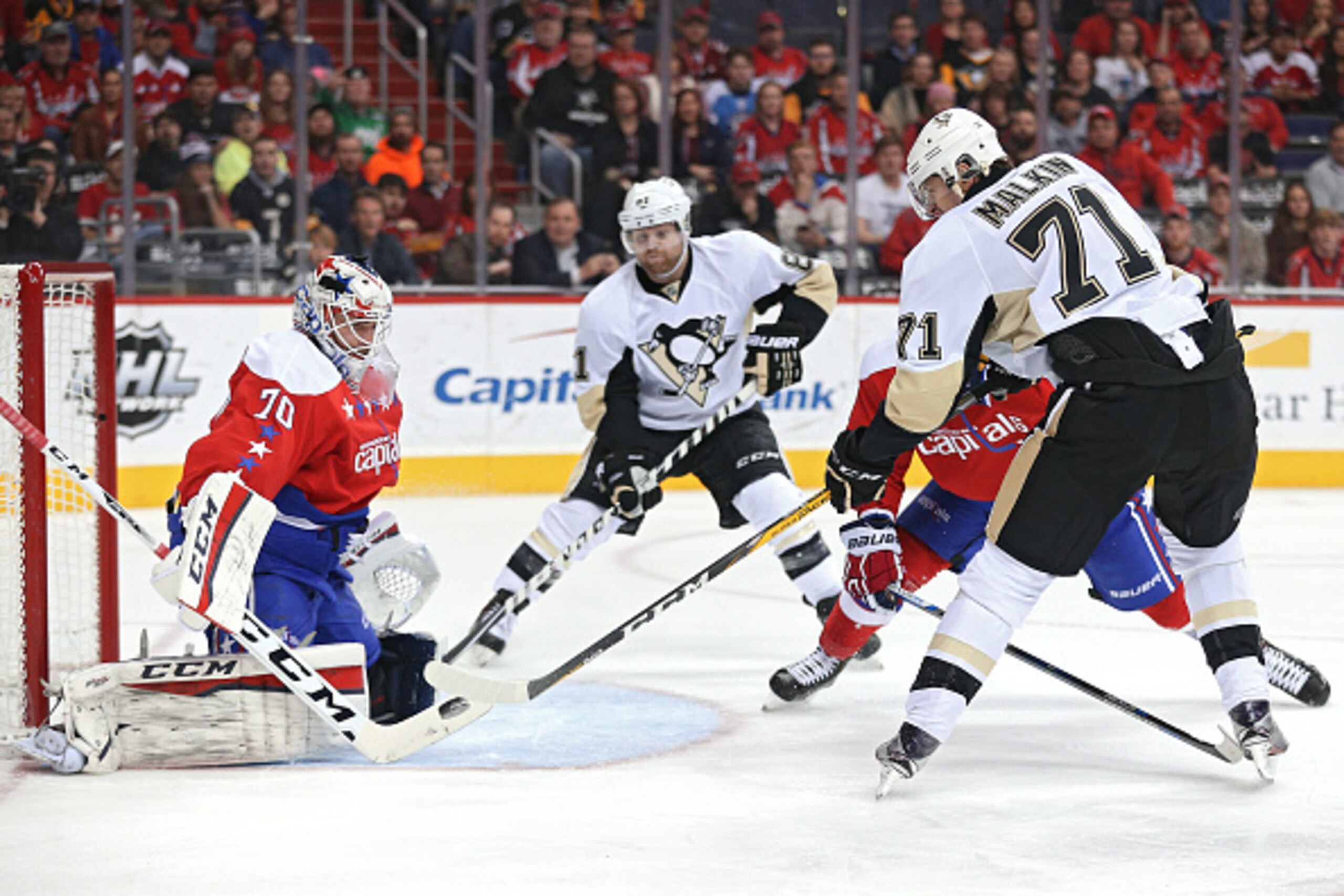 WASHINGTON, DC - MARCH 01: Evgeni Malkin #71 of the Pittsburgh Penguins score a goal past goalie Braden Holtby #70 of the Washington Capitals during the first period at Verizon Center on March 1, 2016 in Washington, DC. (Photo by Patrick Smith/Getty Image