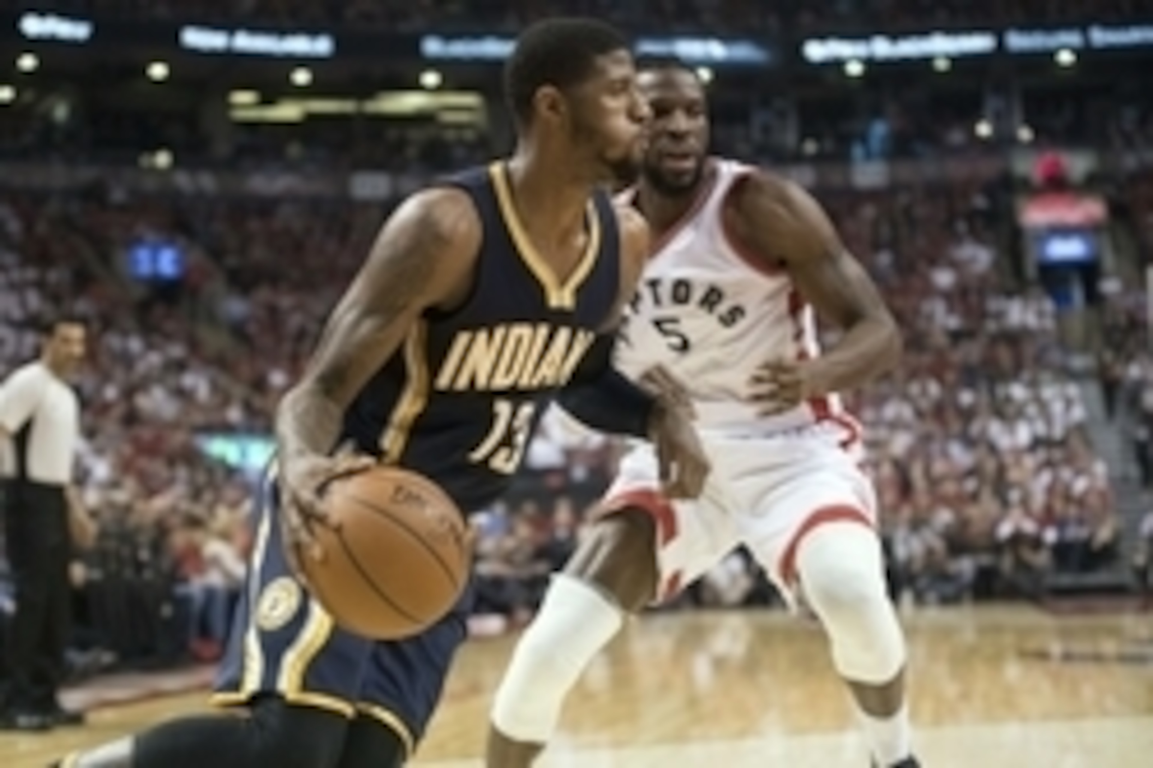 Apr 26, 2016; Toronto, Ontario, CAN; Indiana Pacers forward Paul George (13) drives against Toronto Raptors forward DeMarre Carroll (5) during the second quarter in game five of the first round of the 2016 NBA Playoffs at Air Canada Centre. Mandatory Cred
