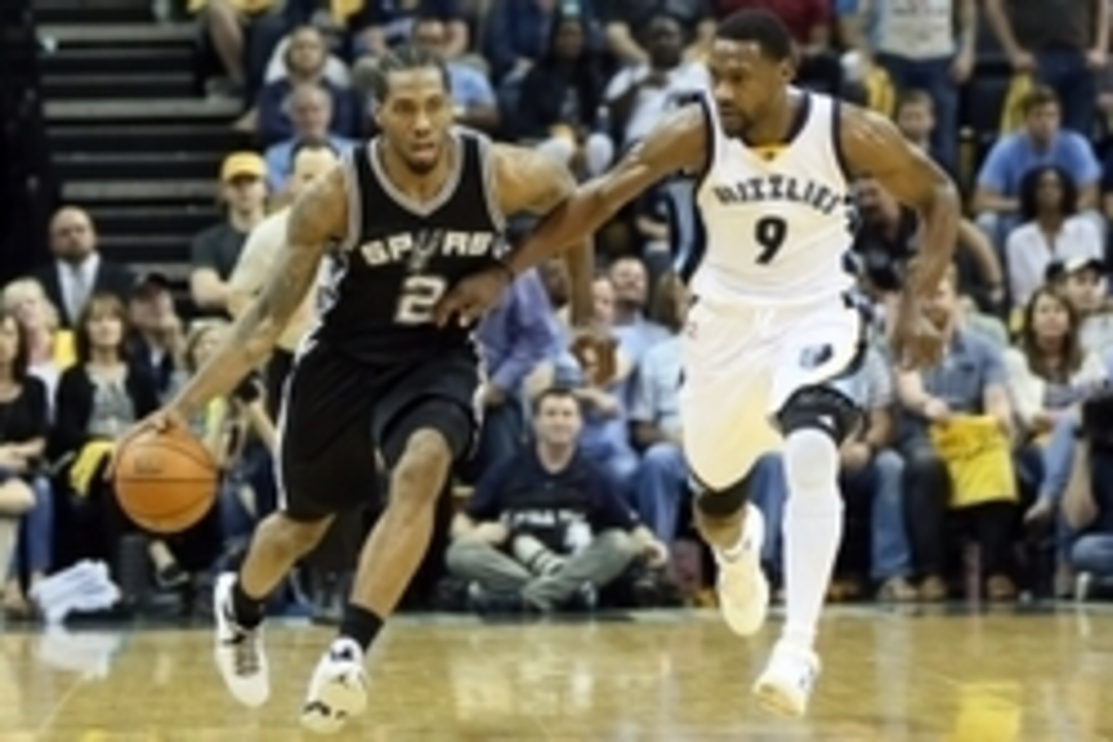 Apr 22, 2016; Memphis, TN, USA; San Antonio Spurs forward Kawhi Leonard (2) dribbles as Memphis Grizzlies guard Tony Allen (9) defends  in game three of the first round of the NBA Playoffs at FedExForum. Spurs defeated Grizzlies 96-87. Mandatory Credit: N