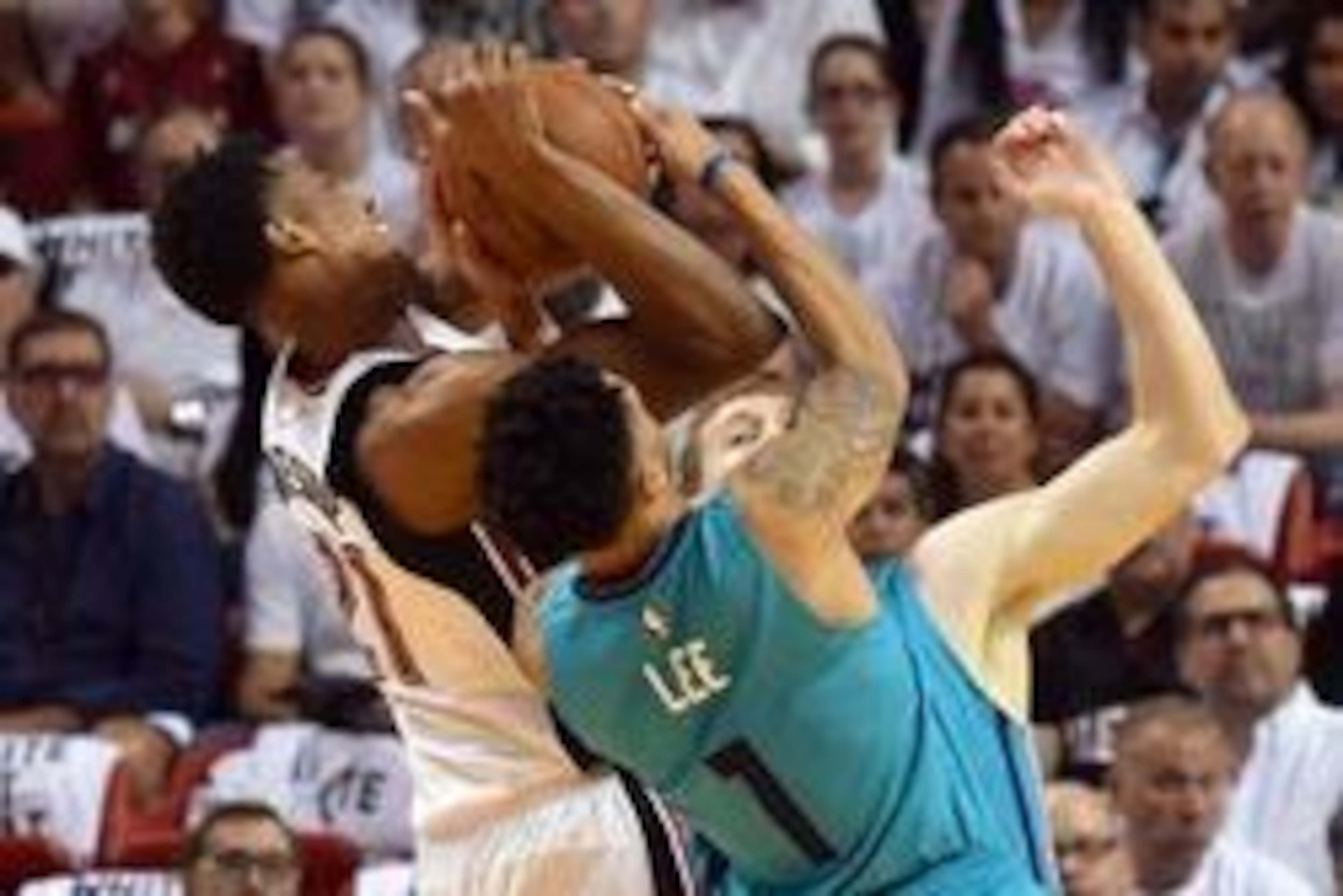 Apr 17, 2016; Miami, FL, USA; Miami Heat center Hassan Whiteside (21) and Charlotte Hornets guard Courtney Lee (1) battle for the ball during the first half in game one of the first round of the NBA Playoffs at American Airlines Arena. Mandatory Credit: S