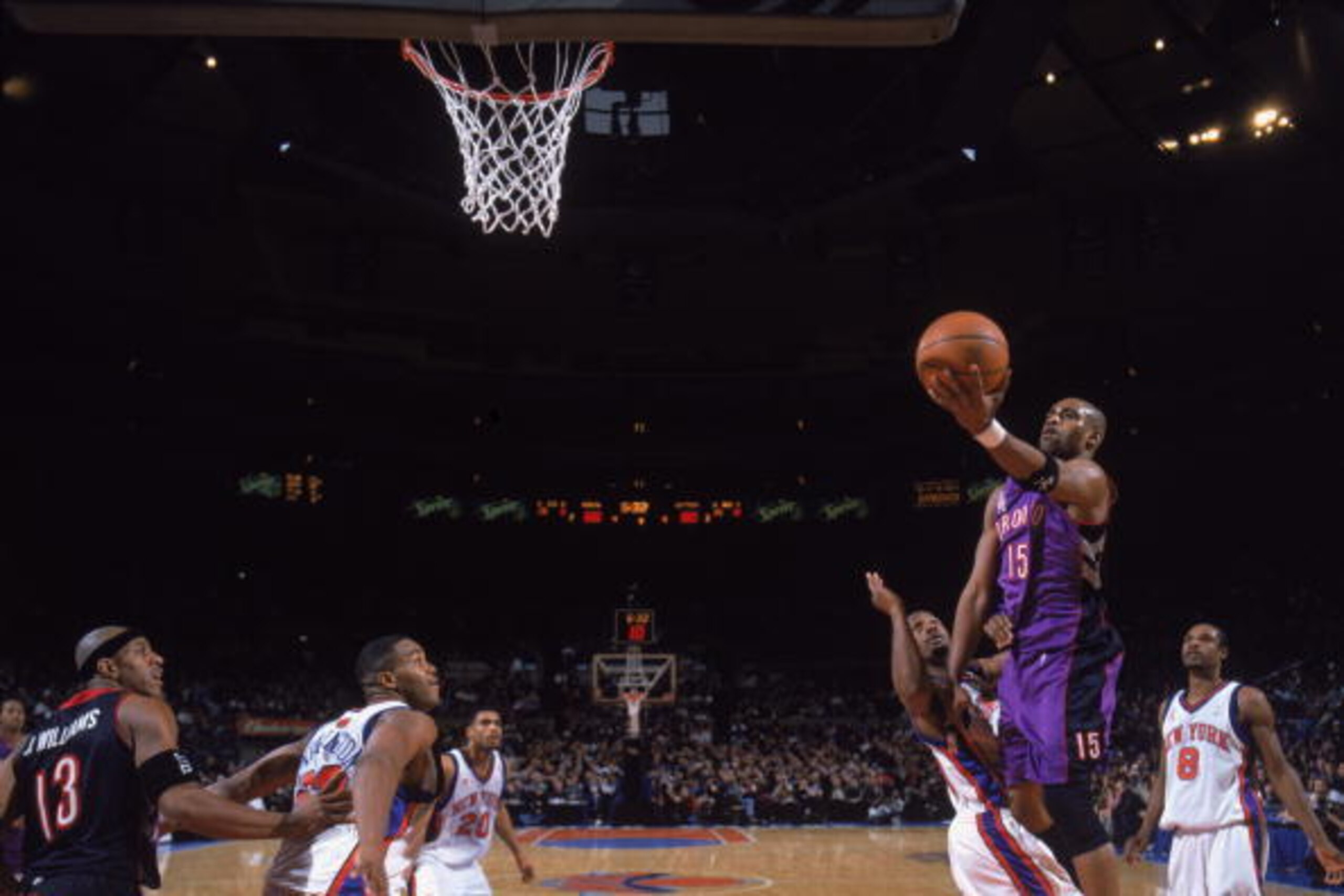 25 Dec 2001:  Guard Vince Carter # 15 of the Toronto Raptors shoots the ball over forward Shandon Anderson #49 of the New York Knicks during the NBA game at Madison Square Garden in New York City, New York. The Knicks defeated the Raptors 102-94.\ NOTE TO
