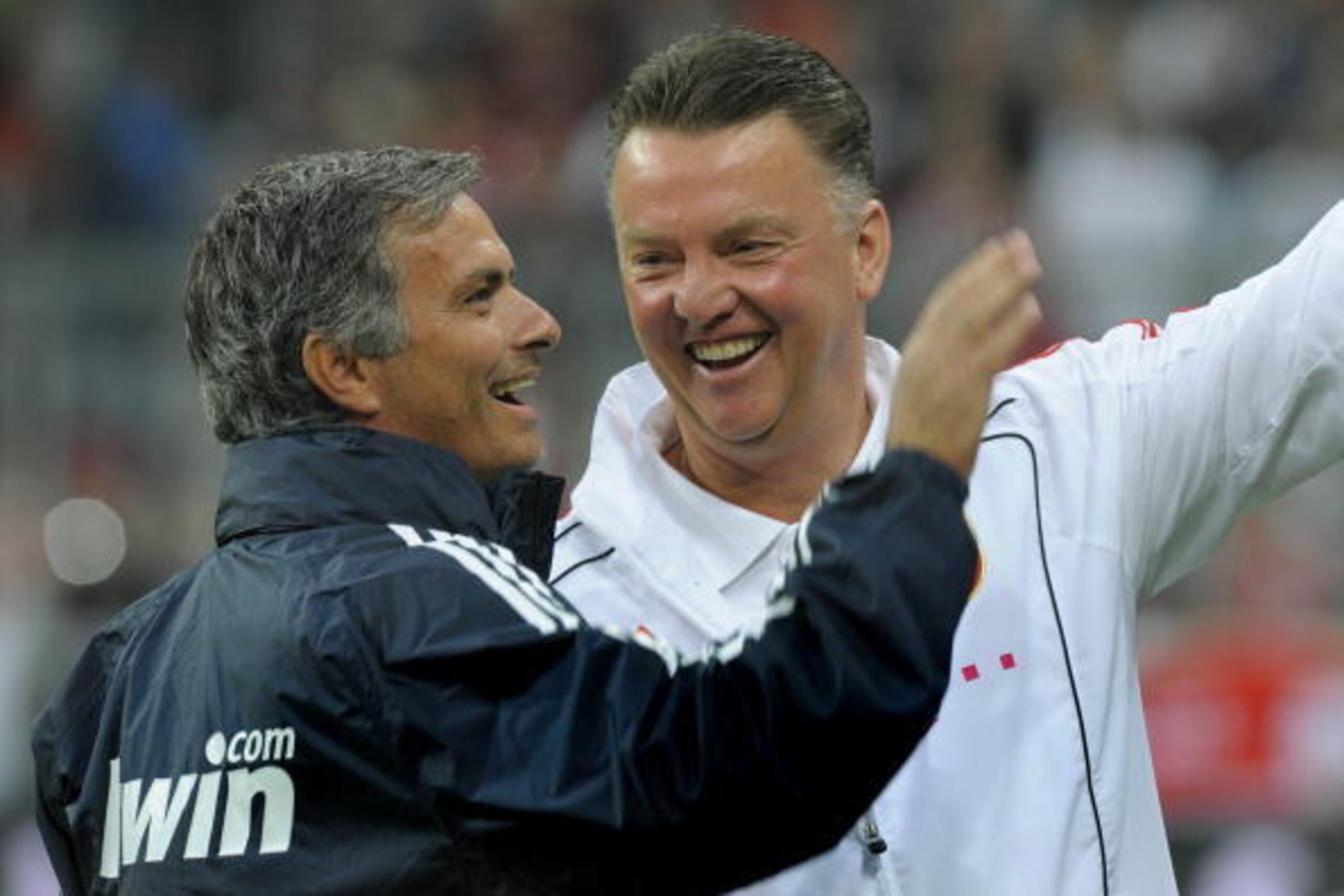Real Madrid's Portuguese coach Jose Mourinho (L) and Bayern Munich's Dutch coach Louis van Gaal share a laugh before a friendly match between German first football division Bundesliga club FC Bayern Munich and Spanish team Real Madrid in Munich, southern 