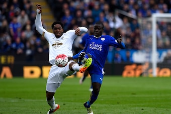LEICESTER, ENGLAND - APRIL 24:  Leroy Fer of Swansea City and Ngolo Kante of Leicester City stretch for the ball during the Barclays Premier League match between Leicester City and Swansea City at The King Power Stadium on April 24, 2016 in Leicester, Uni