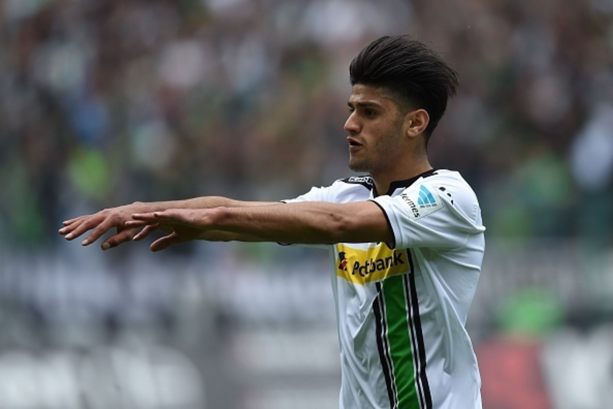 Moenchengladbach's midfielder Mahmoud Dahoud celebrate during the German first division Bundesliga football match Borussia Moenchengladbach vs Hoffenheim in Moenchengladbach, western Germany, on April 24, 2016.  

 / AFP / PATRIK STOLLARZ / RESTRICTIONS: 