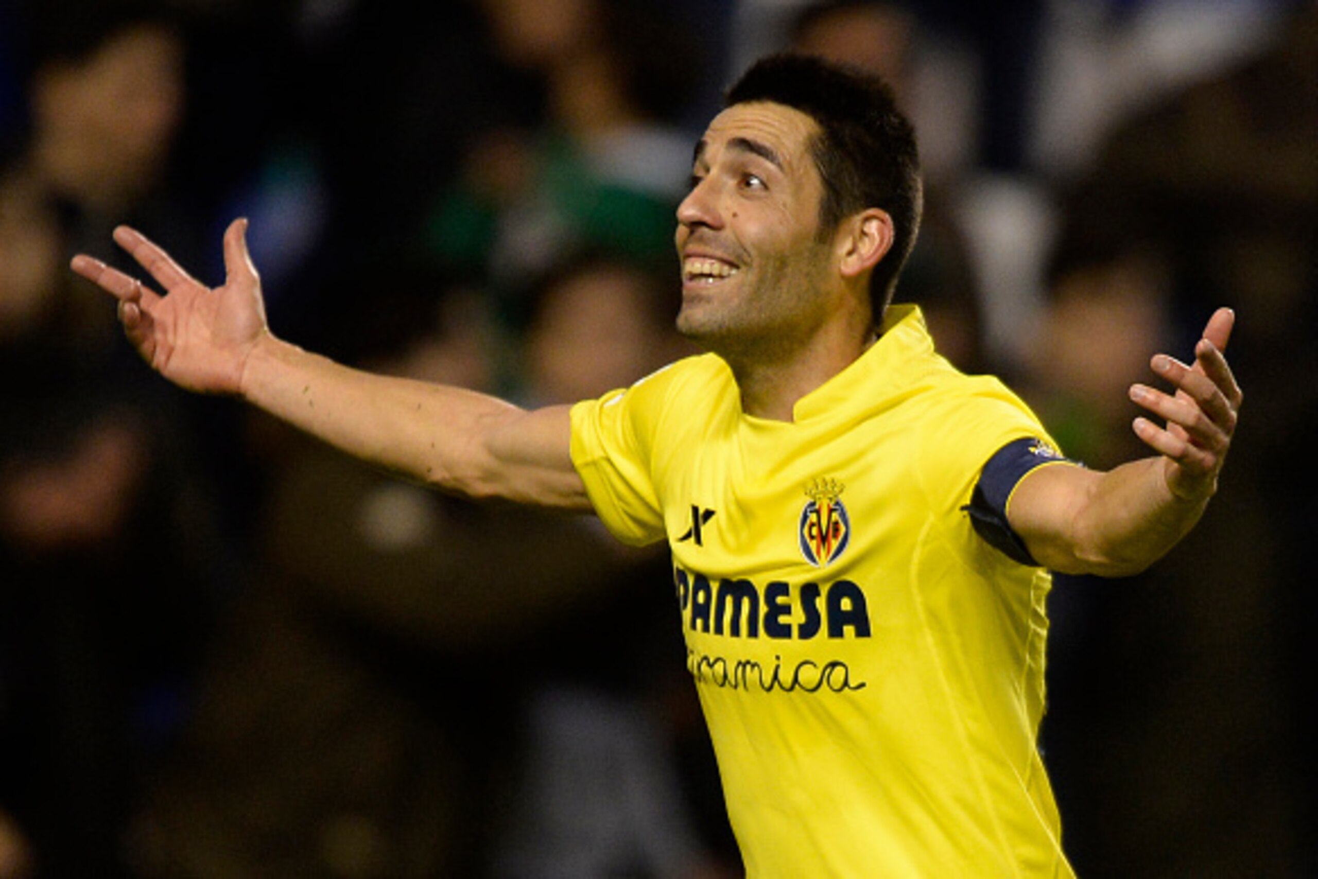 Villarreal's midfielder Bruno Soriano celebrates after scoring a penalty during the Spanish league football match RC Deportivo de la Coruna vs Villarreal CF at the Municipal de Riazor stadium in La Coruna on January 3, 2016.  Villarreal won the match 2-1.