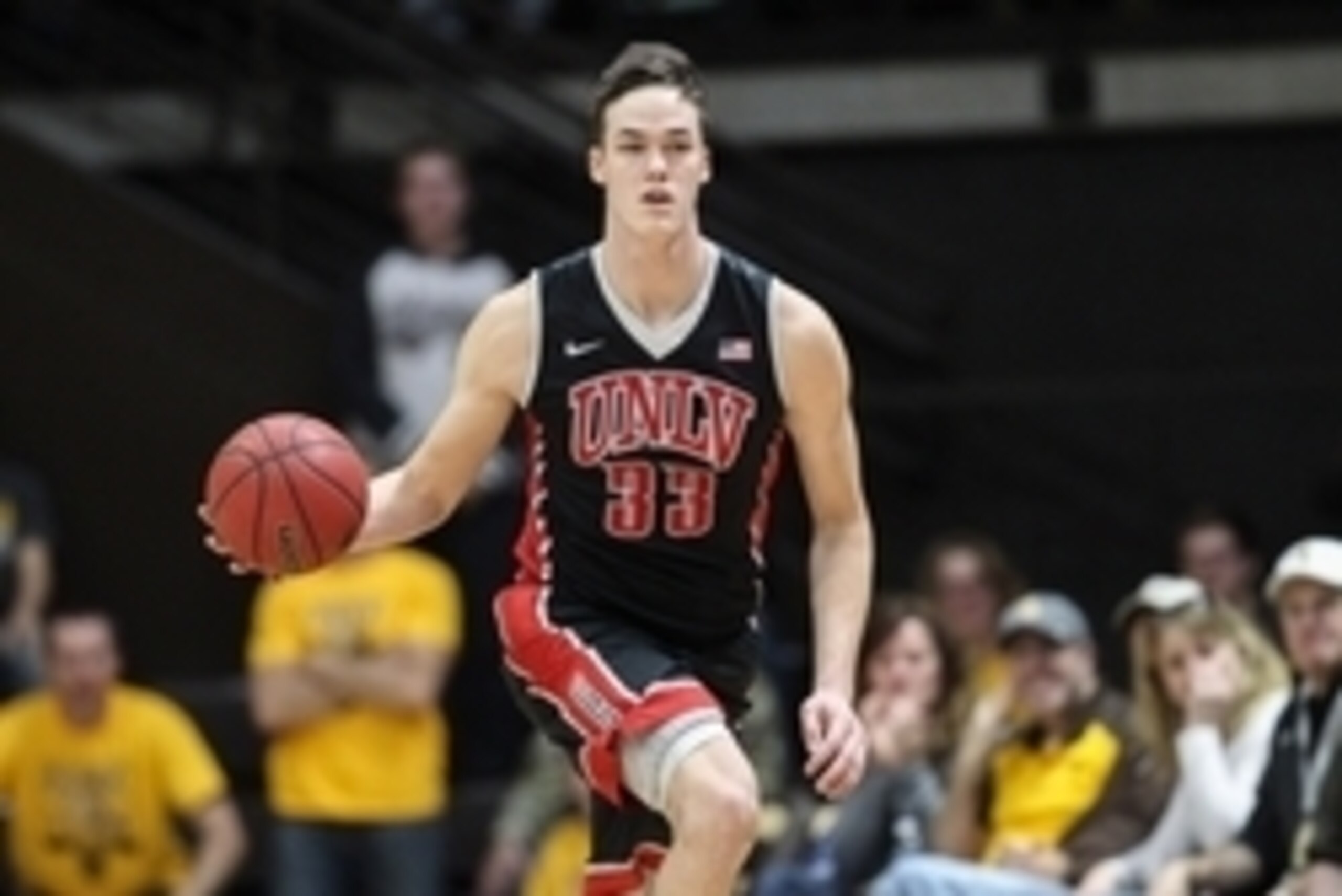 Jan 9, 2016; Laramie, WY, USA; UNLV Runnin' Rebels forward Stephen Zimmerman Jr. (33) brings the ball up court against the Wyoming Cowboys during the first half at Arena-Auditorium. The Cowboys beat the Runnin' Rebels 59-57. Mandatory Credit: Troy Babbitt
