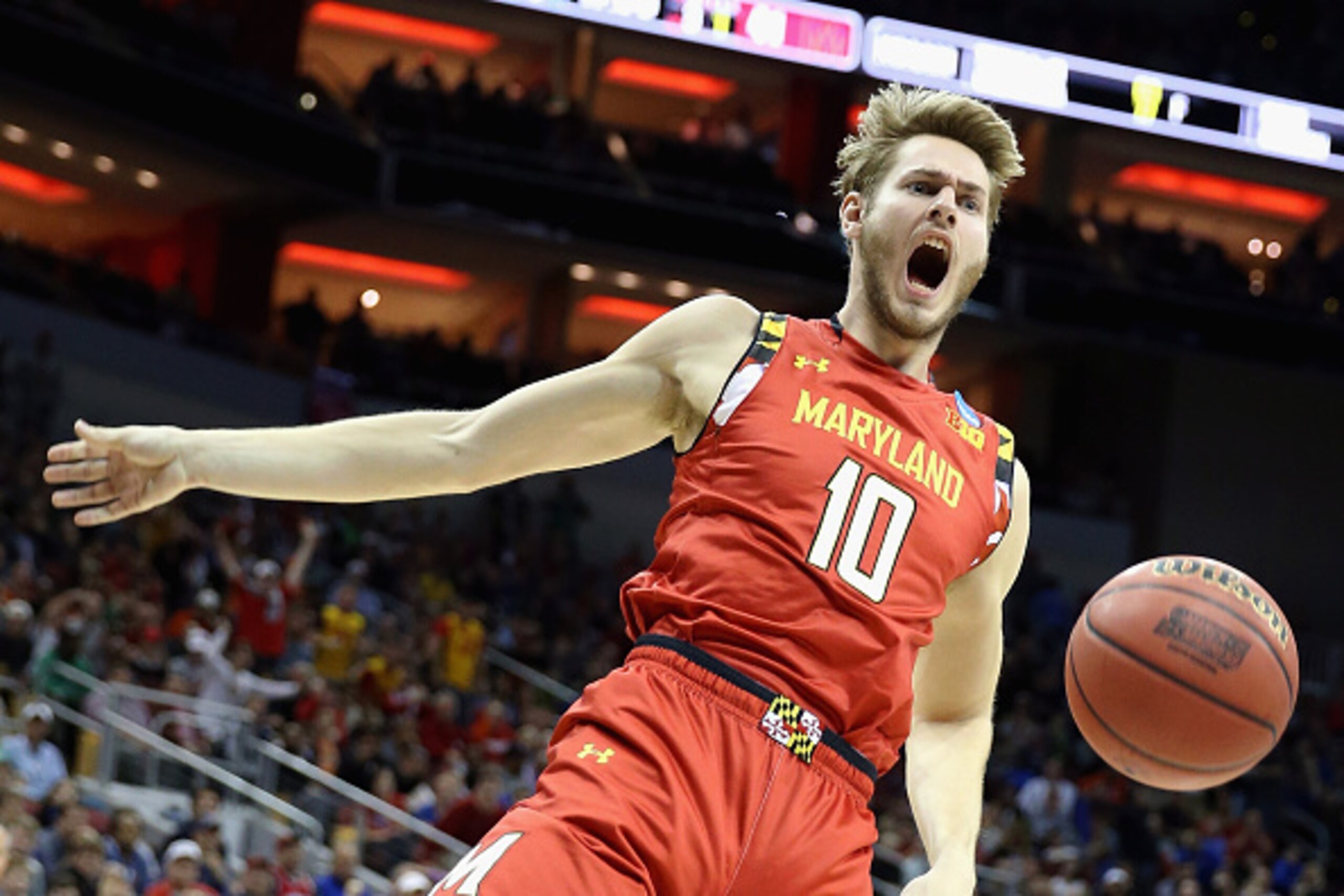LOUISVILLE, KY - MARCH 24:  Jake Layman #10 of the Maryland Terrapins reacts after dunking the ball in the second half against the Kansas Jayhawks during the 2016 NCAA Men's Basketball Tournament South Regional at KFC YUM! Center on March 24, 2016 in Loui