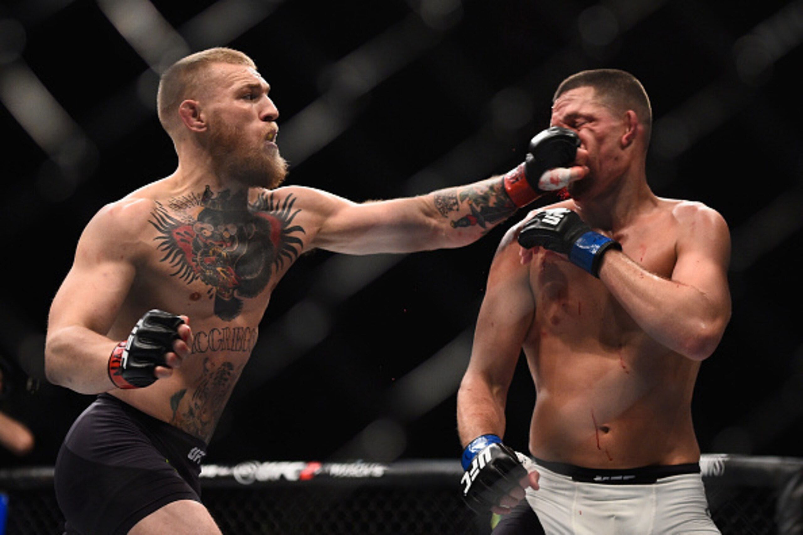 LAS VEGAS, NV - MARCH 05: (L-R) Conor McGregor of Ireland punches Nate Diaz during the UFC 196 event inside MGM Grand Garden Arena on March 5, 2016 in Las Vegas, Nevada. (Photo by Jeff Bottari/Zuffa LLC/Zuffa LLC via Getty Images) LAS VEGAS, NV - MARCH 05: (L-R) Conor McGregor of Ireland punches Nate Diaz during the UFC 196 event inside MGM Grand Garden Arena on March 5, 2016 in Las Vegas, Nevada. (Photo by Jeff Bottari/Zuffa LLC/Zuffa LLC via Getty Images)