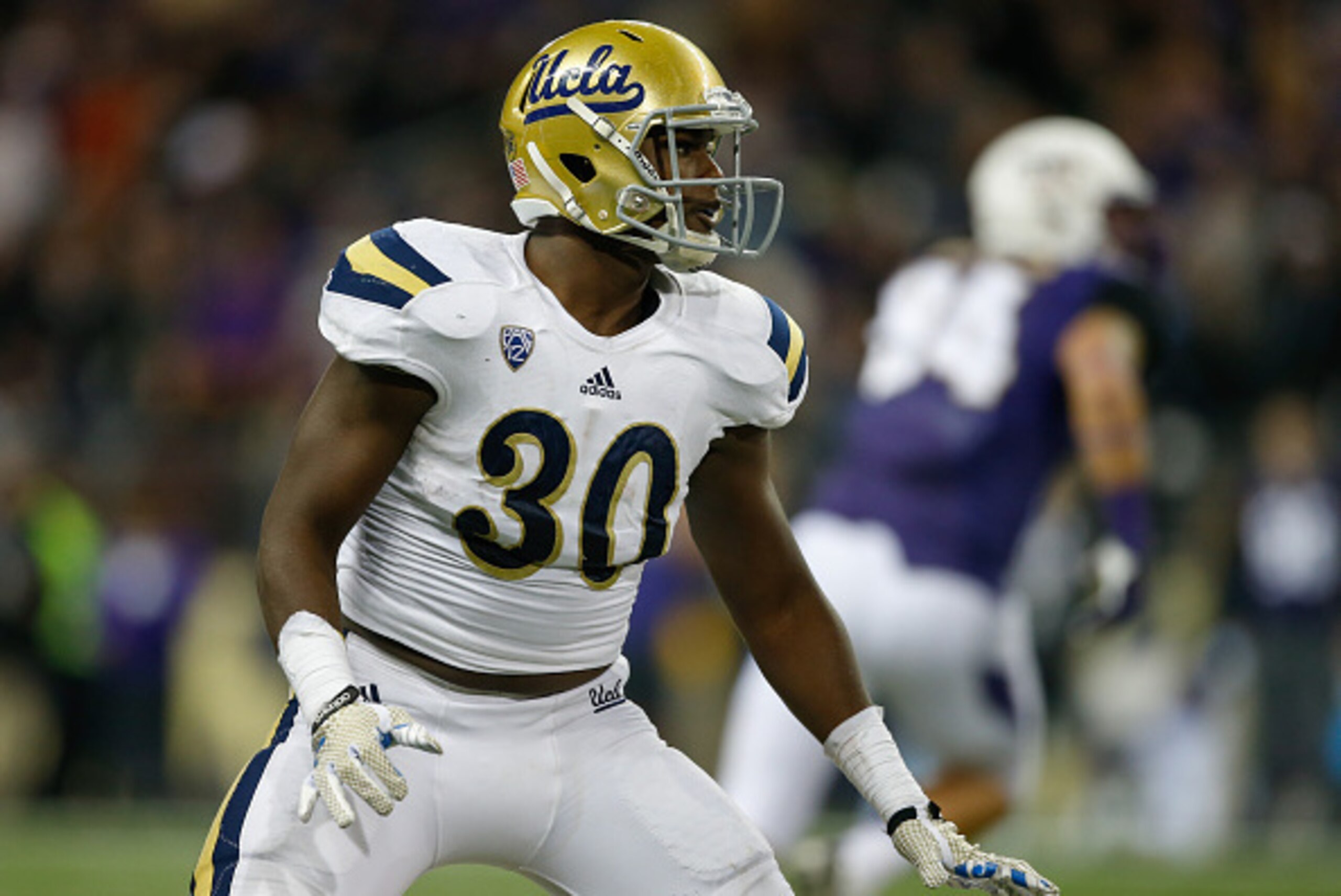 SEATTLE, WA - NOVEMBER 08:  Linebacker Myles Jack #30 of the UCLA Bruins defends against the Washington Huskies on November 8, 2014 at Husky Stadium in Seattle, Washington.  (Photo by Otto Greule Jr/Getty Images)