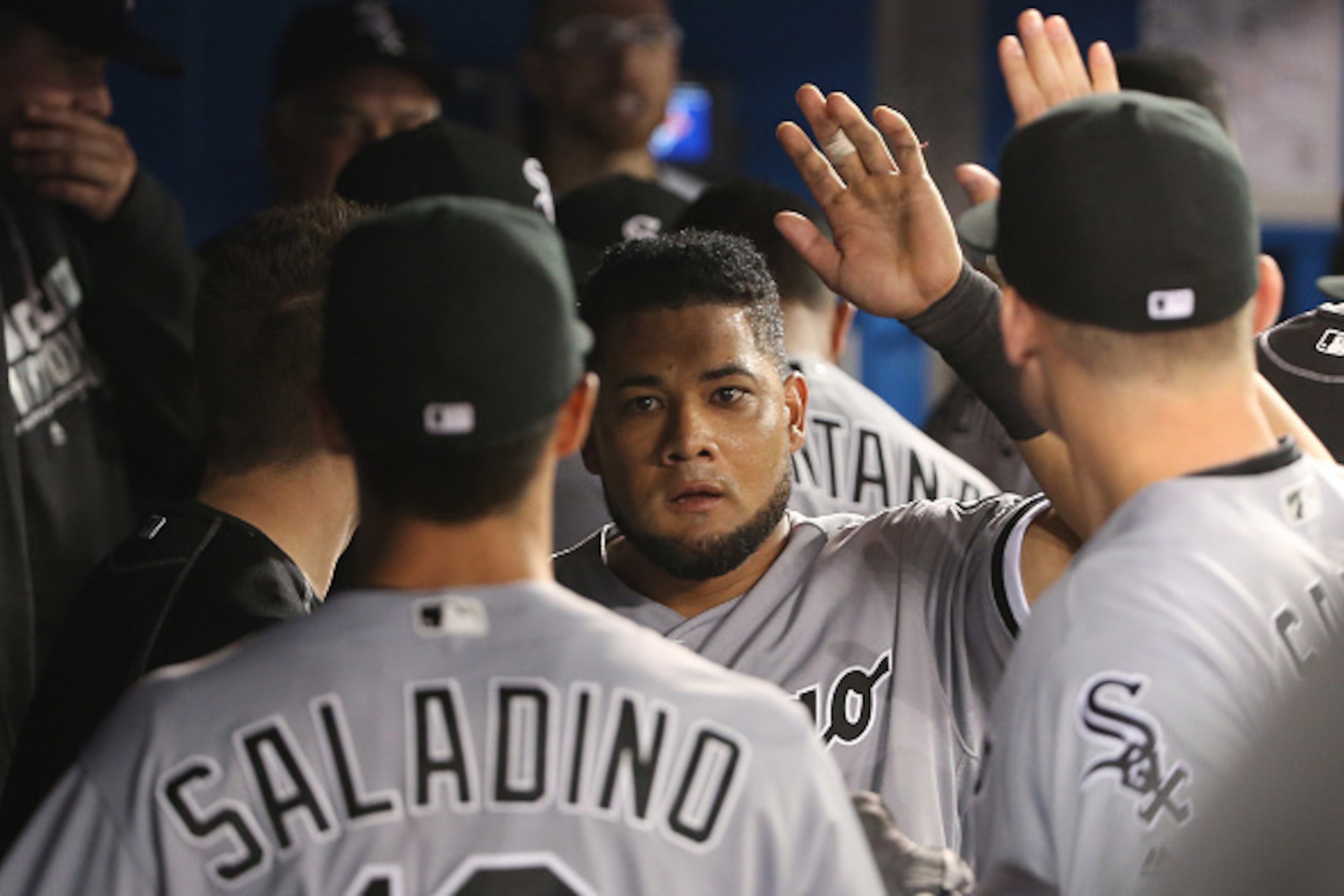 TORONTO, CANADA - APRIL 27: Melky Cabrera #53 of the Chicago White Sox is congratulated by teammates in the dugout after scoring a run in the seventh inning during MLB game action against the Toronto Blue Jays on April 27, 2016 at Rogers Centre in Toronto