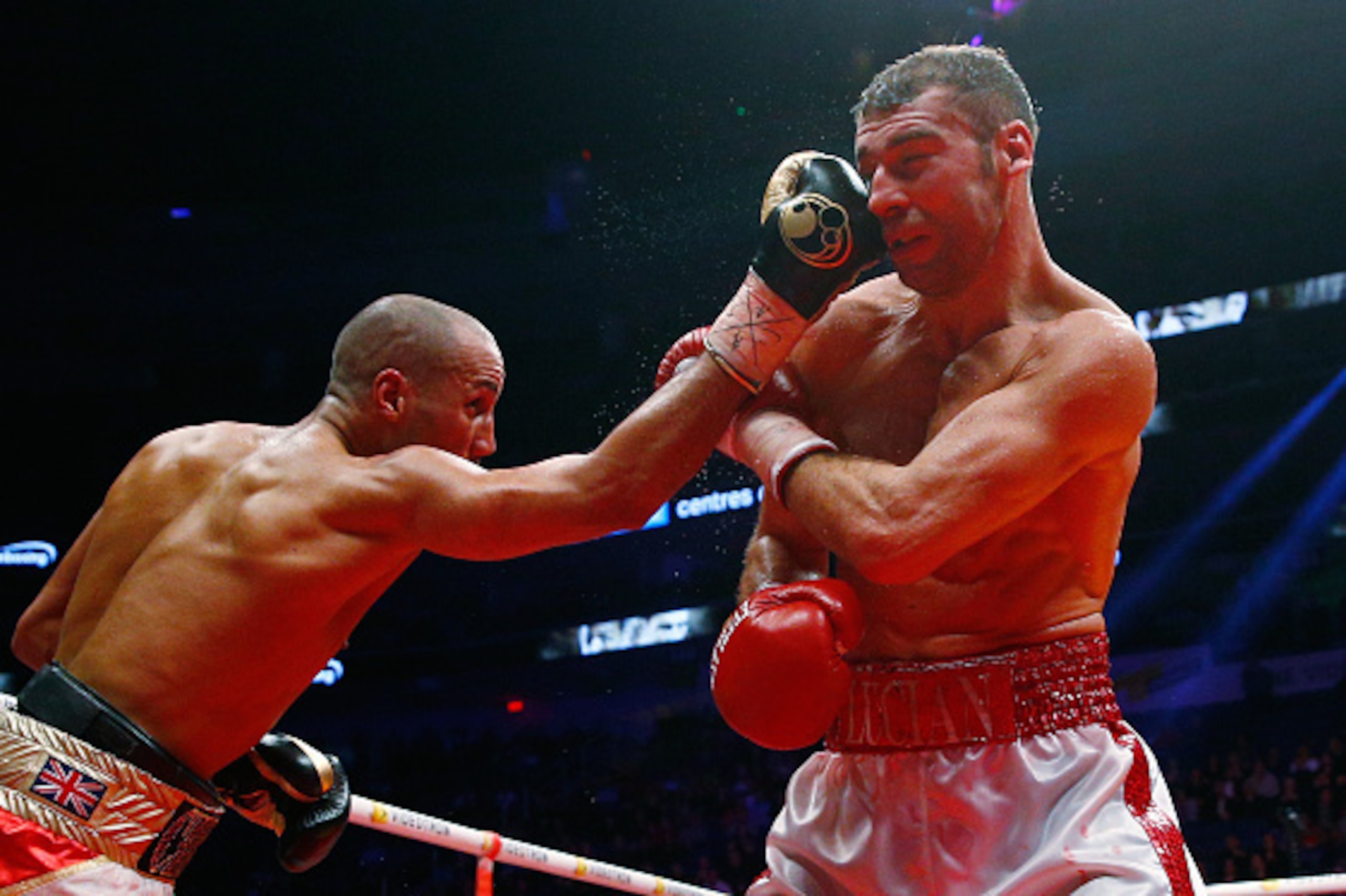 QUEBEC CITY, QC - NOVEMBER 29: James Degale of England throws a punch to Lucian Bute of Canada during their IBF super-middleweight championship fight at the Centre Videotron on November 29, 2015 in Quebec City, Quebec, Canada. (Photo by Mathieu Belanger/G