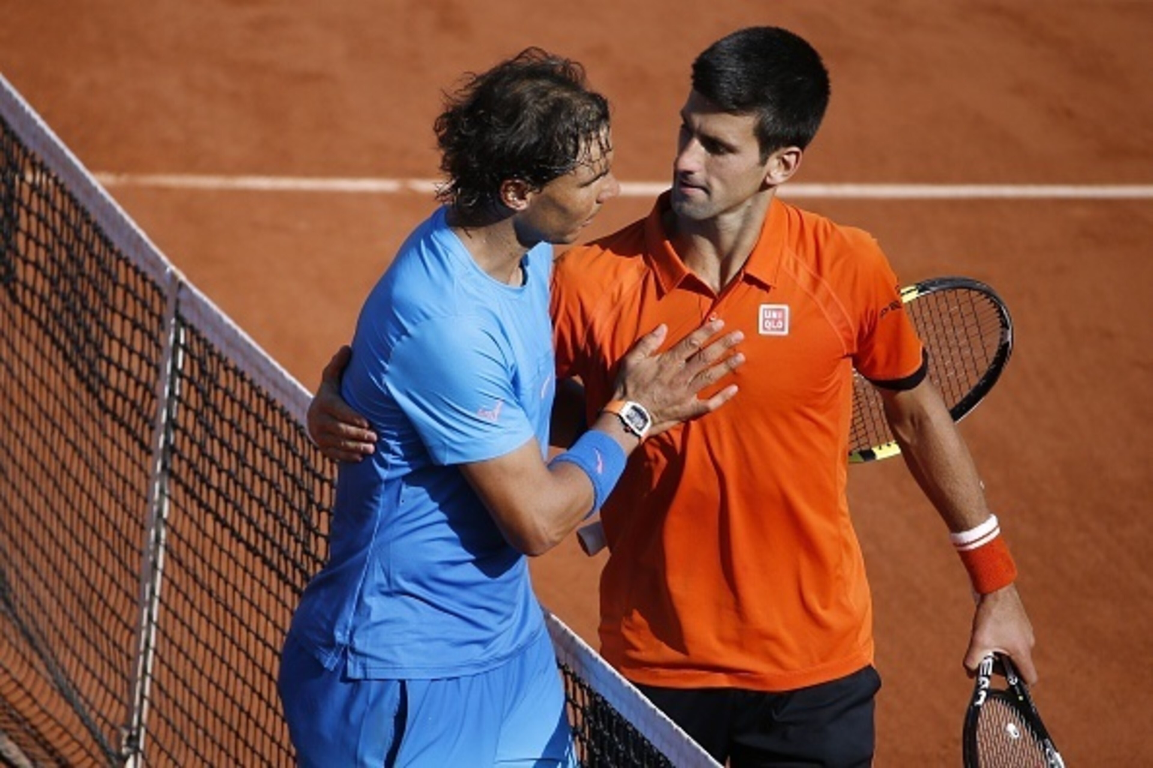 Spain's Rafael Nadal (L) shakes hands with Serbia's Novak Djokovic at the end of their men's quarter final match of the Roland Garros 2015 French Tennis Open in Paris on June 3, 2015. AFP PHOTO / KENZO TRIBOUILLARD (Photo credit should read KENZO Spain's Rafael Nadal (L) shakes hands with Serbia's Novak Djokovic at the end of their men's quarter final match of the Roland Garros 2015 French Tennis Open in Paris on June 3, 2015. AFP PHOTO / KENZO TRIBOUILLARD (Photo credit should read KENZO
