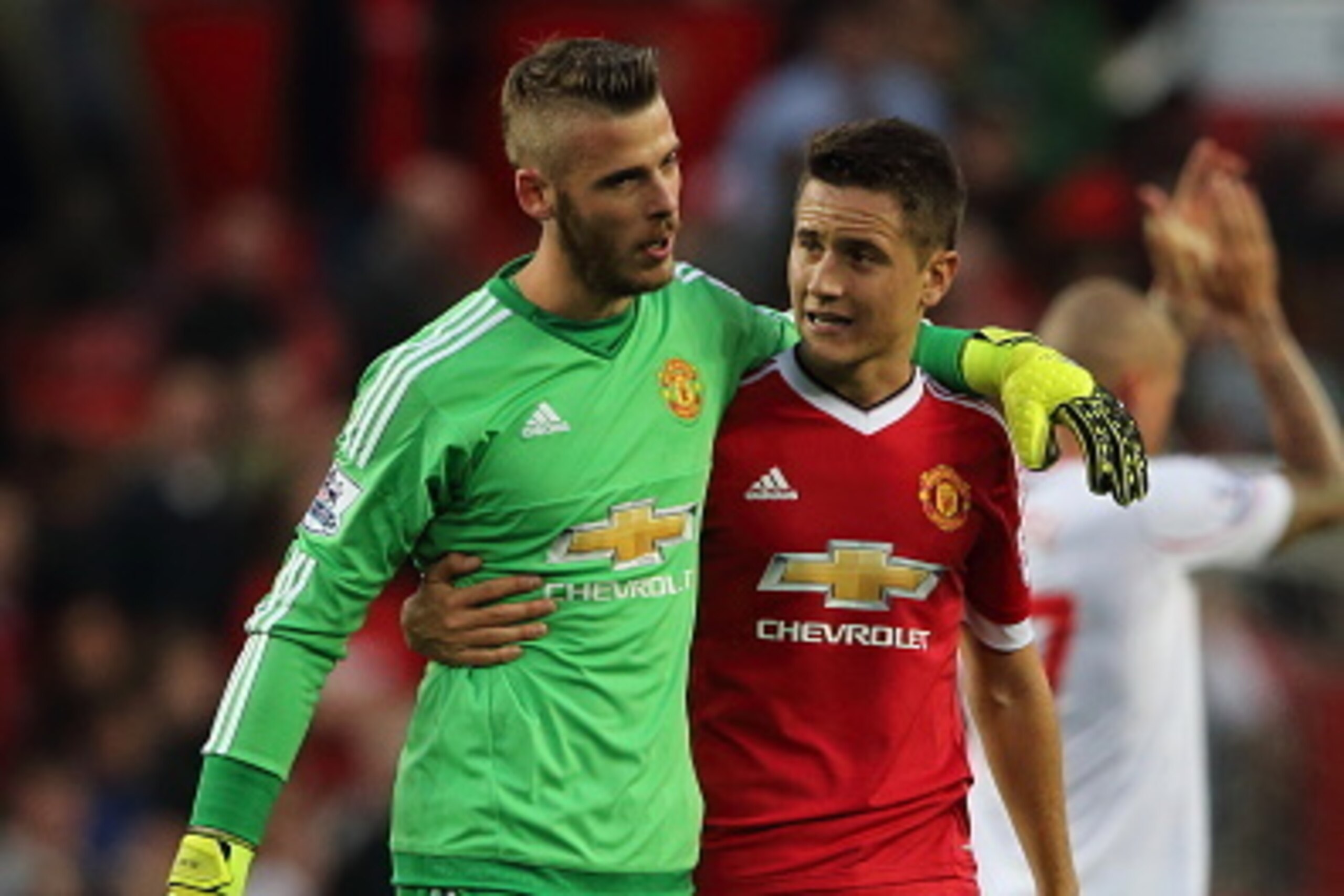 MANCHESTER, ENGLAND - SEPTEMBER 12:  David De Gea of Manchester United walks off with Ander Herrera of Manchester United after the 3-1 victory in the Barclays Premier League match between Manchester United and Liverpool on September 12, 2015 in Manchester