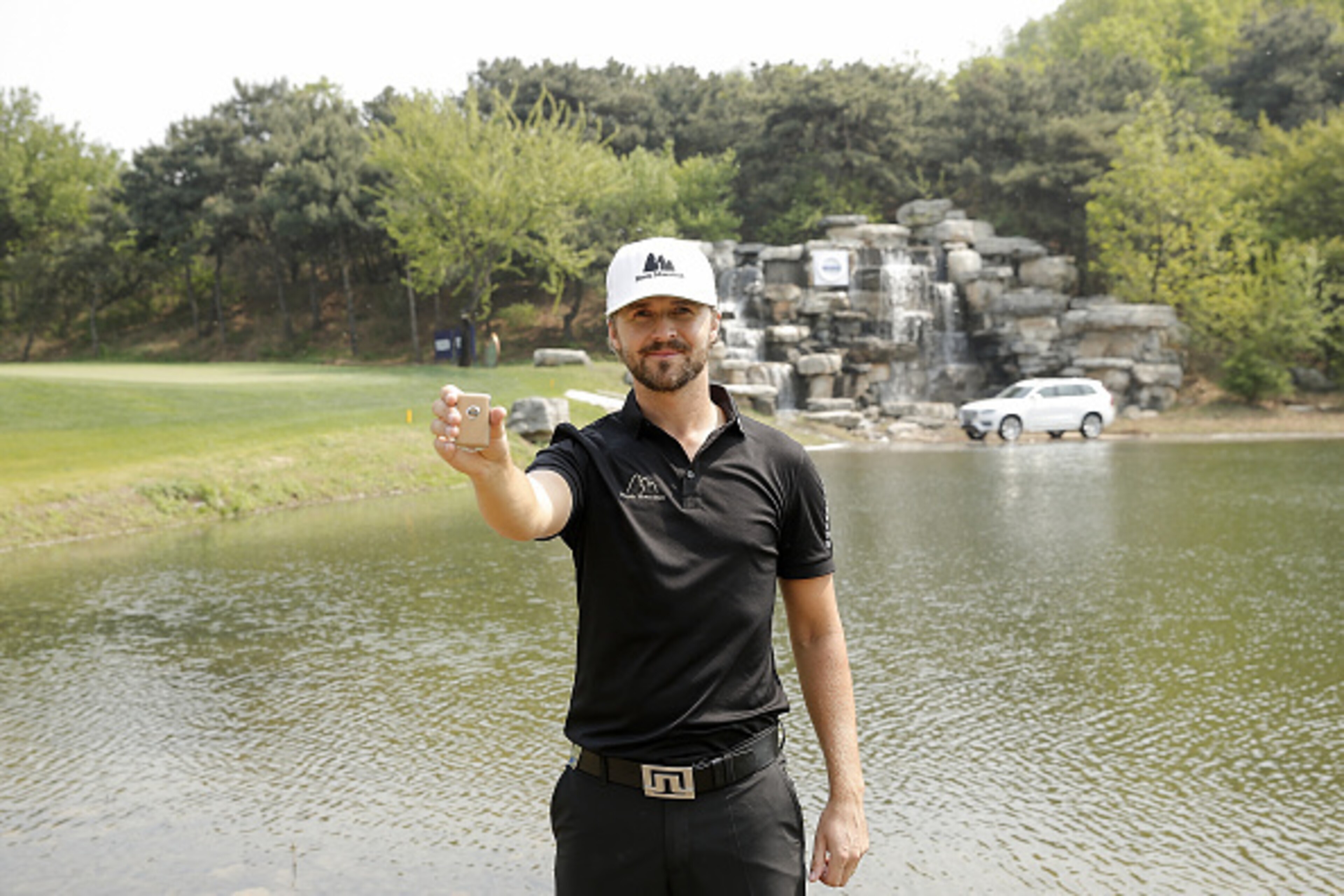 BEIJING, CHINA - APRIL 28:  Rikard Karlberg of Sweden celebrates wins a hole in one prize at the 16th hole during the Volvo China open April 28, 2016 in Shanghai, China.  (Photo by Lintao Zhang/Getty Images)