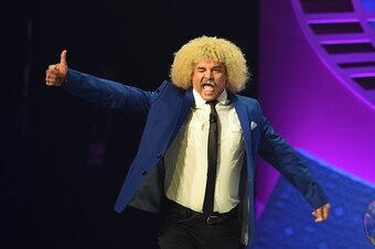 Former Colombian football player Carlos Valderrama arrives on stage during the draw for the Copa America Centenario 2016 championship at the Hammerstein Ballroom in New York on February 21, 2016. 
The Copa America Centenario, a once-in-a-lifetime soccer s
