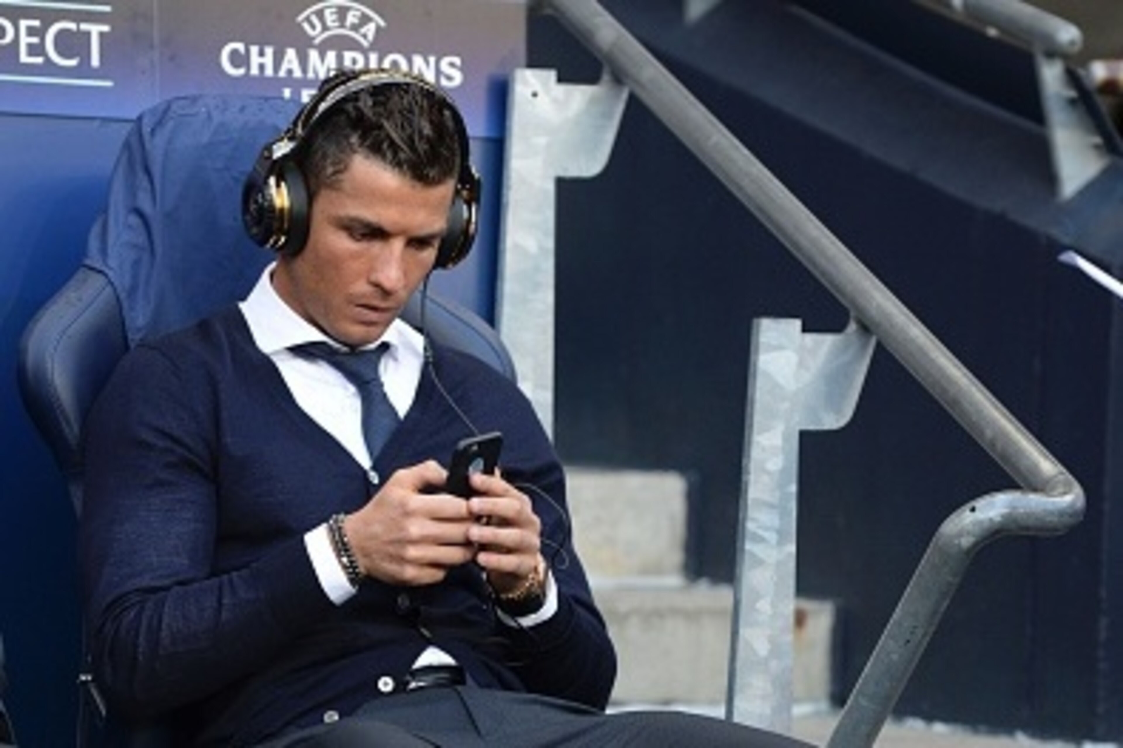 Real Madrid's Portuguese forward Cristiano Ronaldo sits in the dug-out ahead of kick off of the UEFA Champions League semi-final first leg football match between Manchester City and Real Madrid at the Etihad Stadium in Manchester, northwest England, on Ap