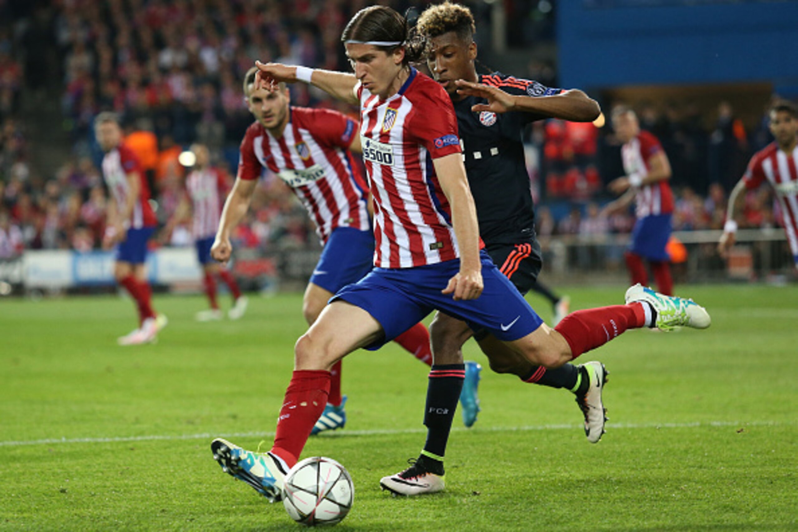 MADRID, SPAIN - APRIL 27: Filipe Luis of Atletico Madrid and Kingsley Coman of Bayern Munich in action during the UEFA Champions League semi final first leg match between Club Atletico Madrid and FC Bayern Muenchen (Bayern Munich) at Estadio Vicente Calde