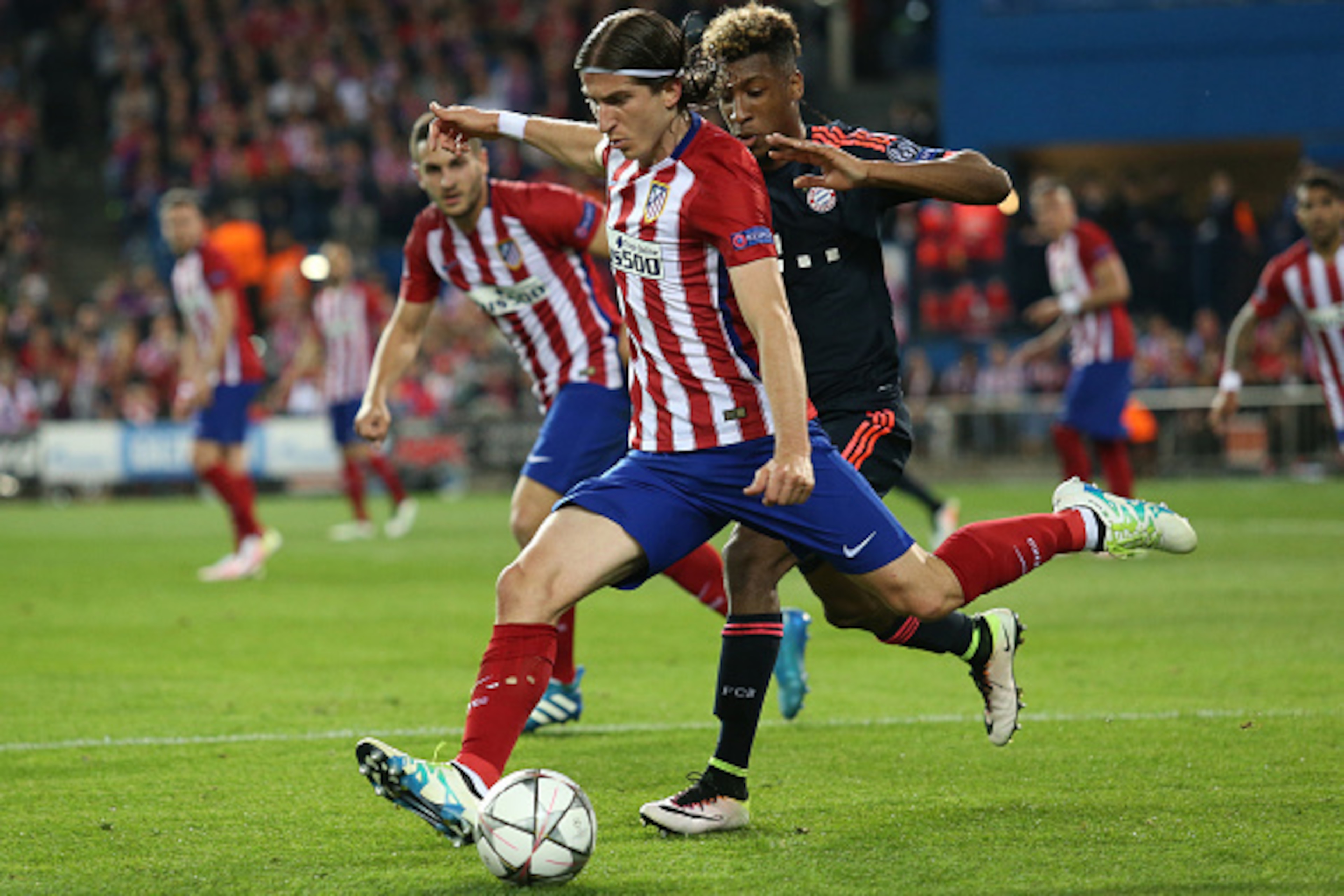 MADRID, SPAIN - APRIL 27: Filipe Luis of Atletico Madrid and Kingsley Coman of Bayern Munich in action during the UEFA Champions League semi final first leg match between Club Atletico Madrid and FC Bayern Muenchen (Bayern Munich) at Estadio Vicente Calde