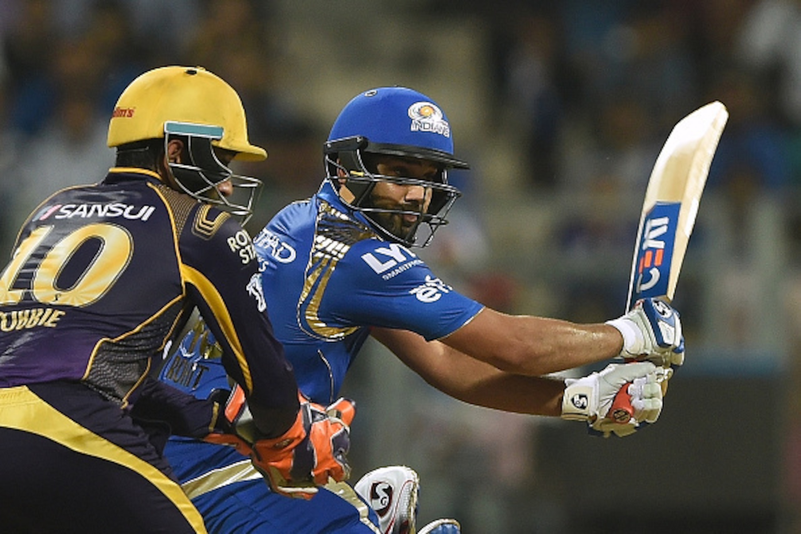 Mumbai Indians captain Rohit Sharma (R) plays a shot during the 2016 Indian Premier League (IPL) Twenty20 cricket match between Mumbai Indians and Kolkata Knight Riders at The Wankhede Cricket Stadium in Mumbai on April 28, 2016.ï¿½ï¿½ï¿½ï¿½ / AFP / PUNIT PARANJP