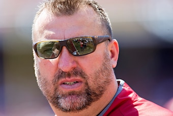 FAYETTEVILLE, AR - APRIL 23:  Head Coach Bret Bielema of the Arkansas Razorbacks White team watches his team warm up before the annual Razorback Red & White Spring Game at Donald W. Reynolds Razorback Stadium on April 23, 2016 in Fayetteville, Arkansas.  