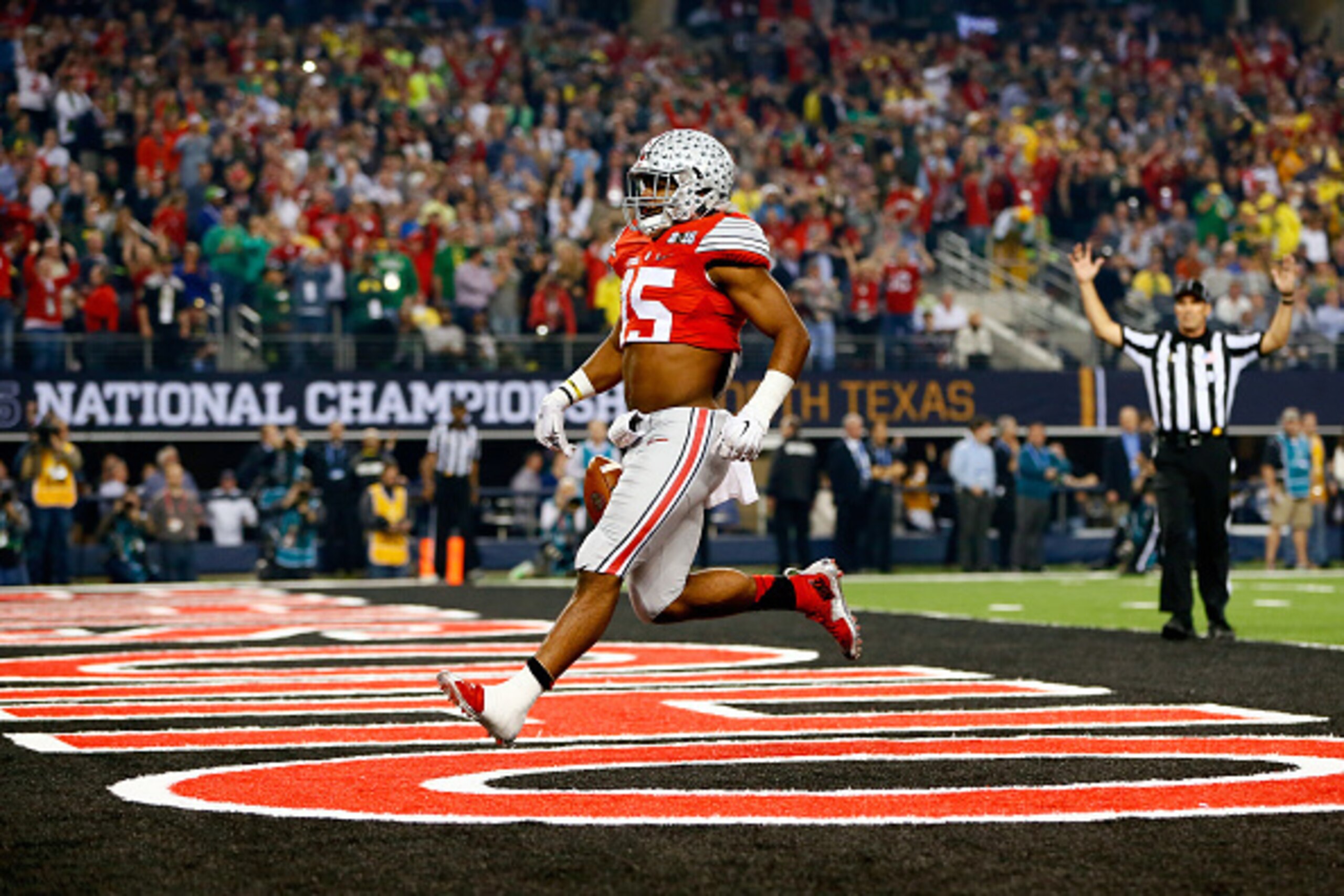 ARLINGTON, TX - JANUARY 12:  Running back Ezekiel Elliott #15 of the Ohio State Buckeyes scores a 33 yard touchdown in the first quarter against the Oregon Ducks during the College Football Playoff National Championship Game at AT&T Stadium on January 12,