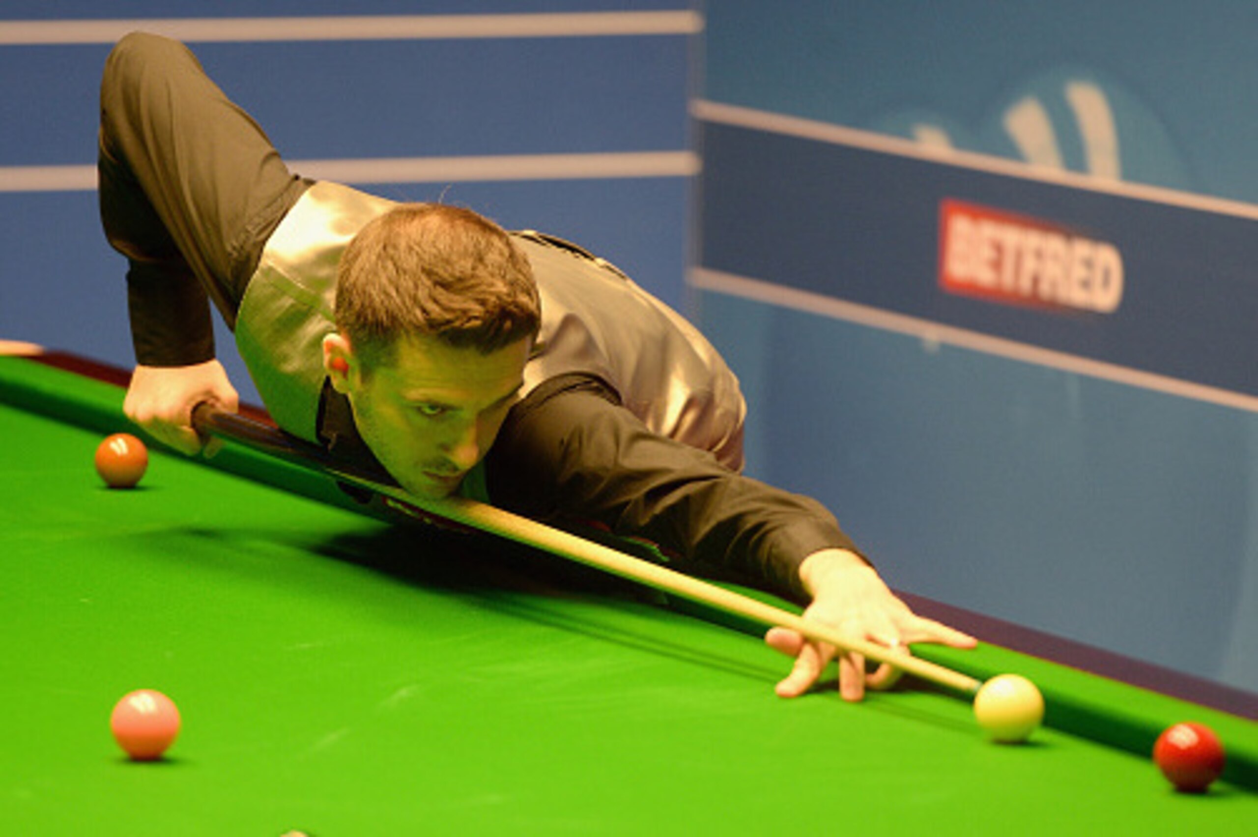 SHEFFIELD, ENGLAND - APRIL 19:  Mark Selby plays a shot against Robert Milkins during their first round match of the World Snooker Championship at Crucible Theatre on April 19, 2016 in Sheffield, England.  (Photo by Gareth Copley/Getty Images)