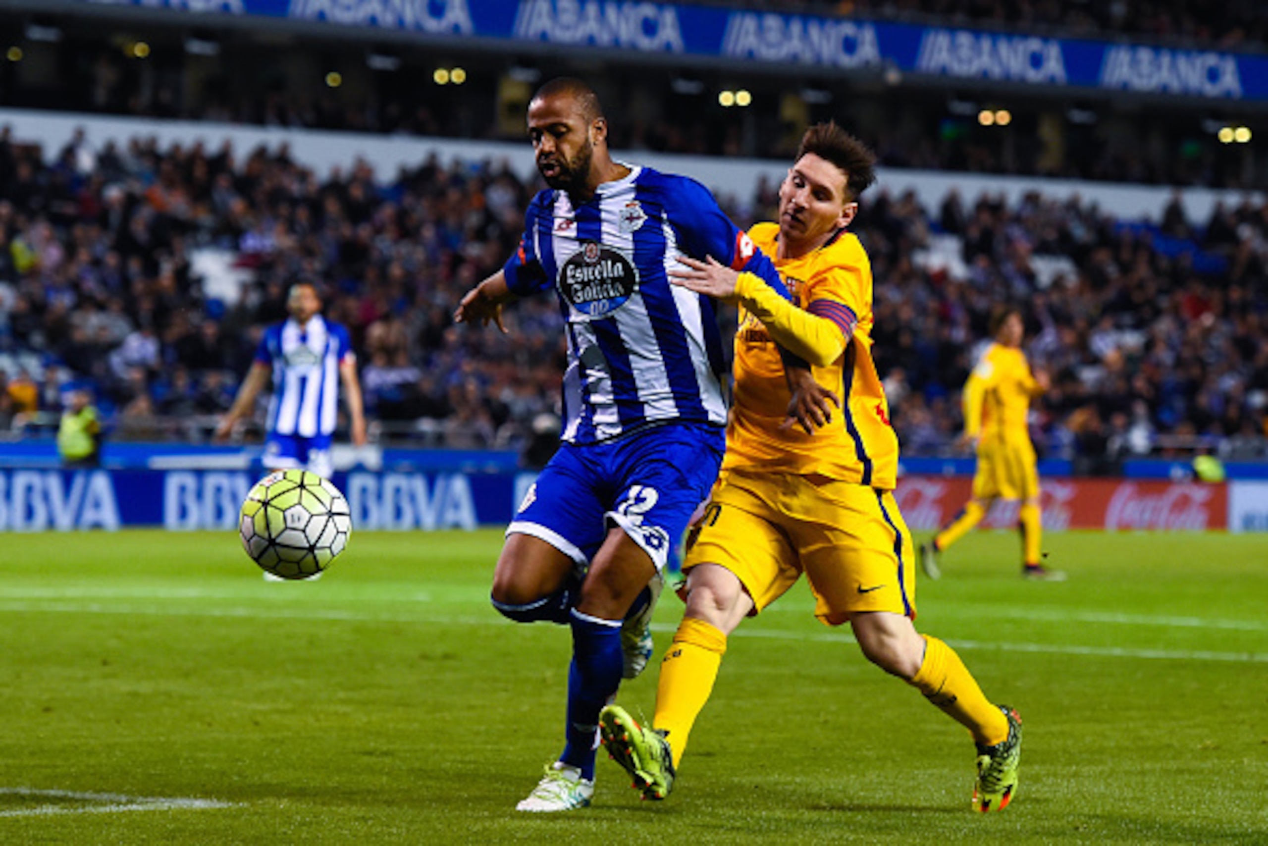 LA CORUNA, SPAIN - APRIL 20:  Lionel Messi of FC Barcelona competes for the ball with Sidnei Rechel da Silva of RC Deportivo La Coruna during the La Liga match between RC Deportivo La Coruna and FC Barcelona at Riazor Stadium on April 20, 2016 in La Corun