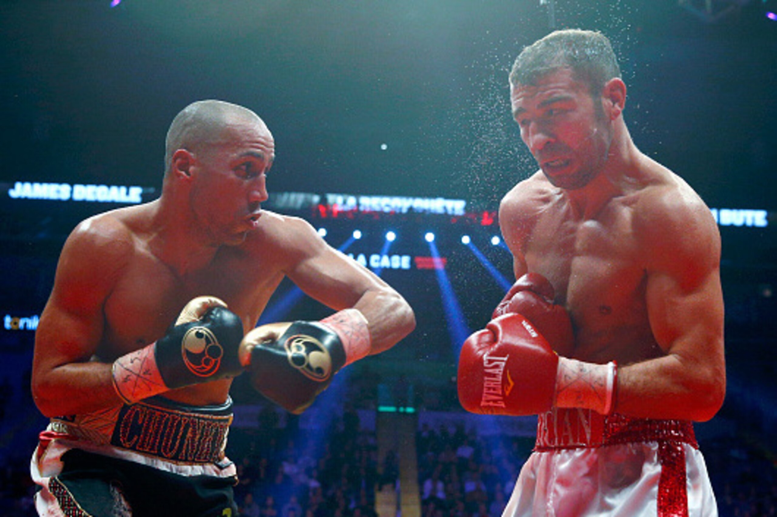 QUEBEC CITY, QC - NOVEMBER 29: James Degale of England throws a punch to Lucian Bute of Canada during their IBF super-middleweight championship fight at the Centre Videotron on November 29, 2015 in Quebec City, Quebec, Canada. (Photo by Mathieu Belanger/G
