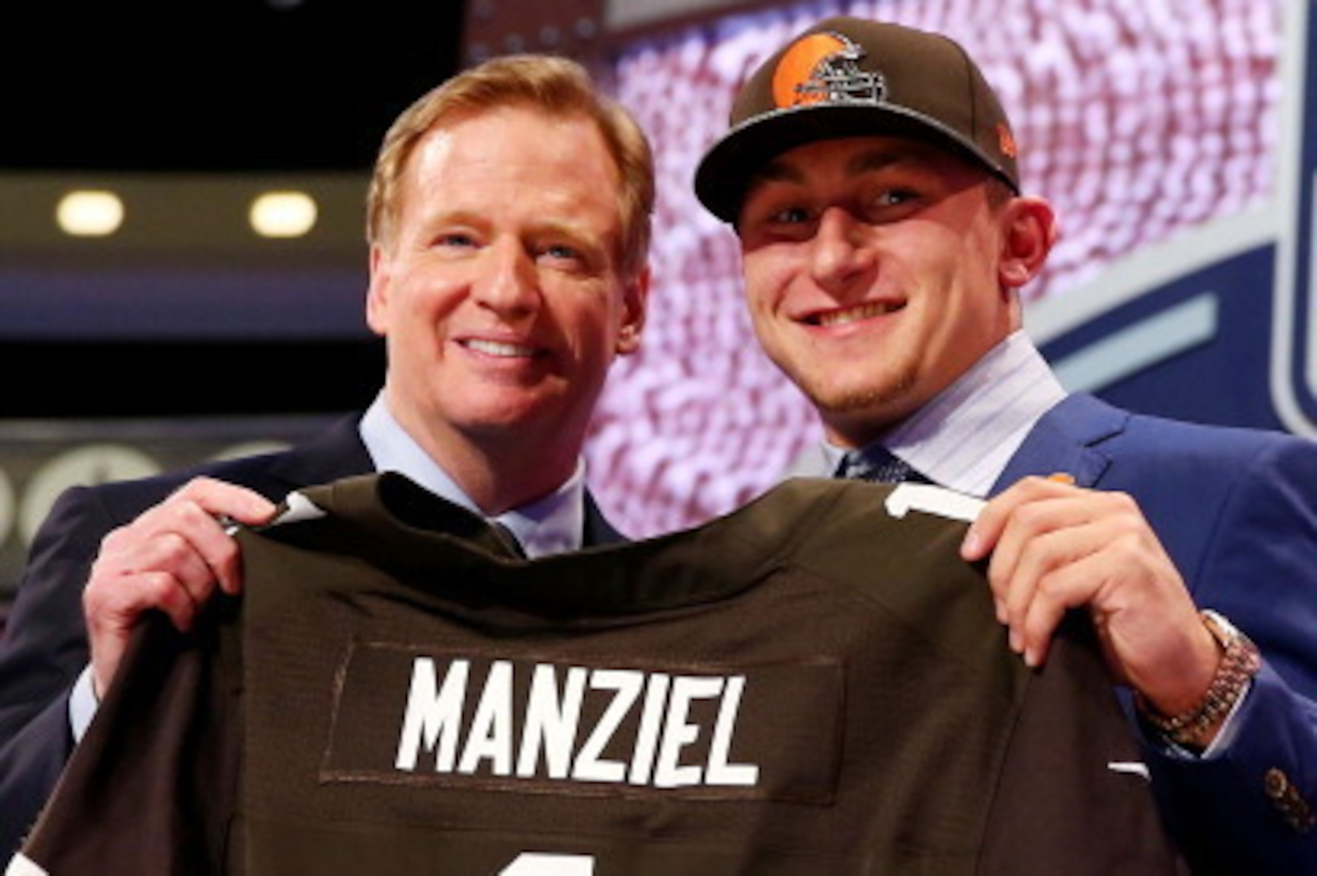 NEW YORK, NY - MAY 08: Johnny Manziel of the Texas A&M Aggies poses with NFL Commissioner Roger Goodell after he was picked #22 overall by the Cleveland Browns during the first round of the 2014 NFL Draft at Radio City Music Hall on May 8, 2014 in New Yo NEW YORK, NY - MAY 08: Johnny Manziel of the Texas A&M Aggies poses with NFL Commissioner Roger Goodell after he was picked #22 overall by the Cleveland Browns during the first round of the 2014 NFL Draft at Radio City Music Hall on May 8, 2014 in New Yo