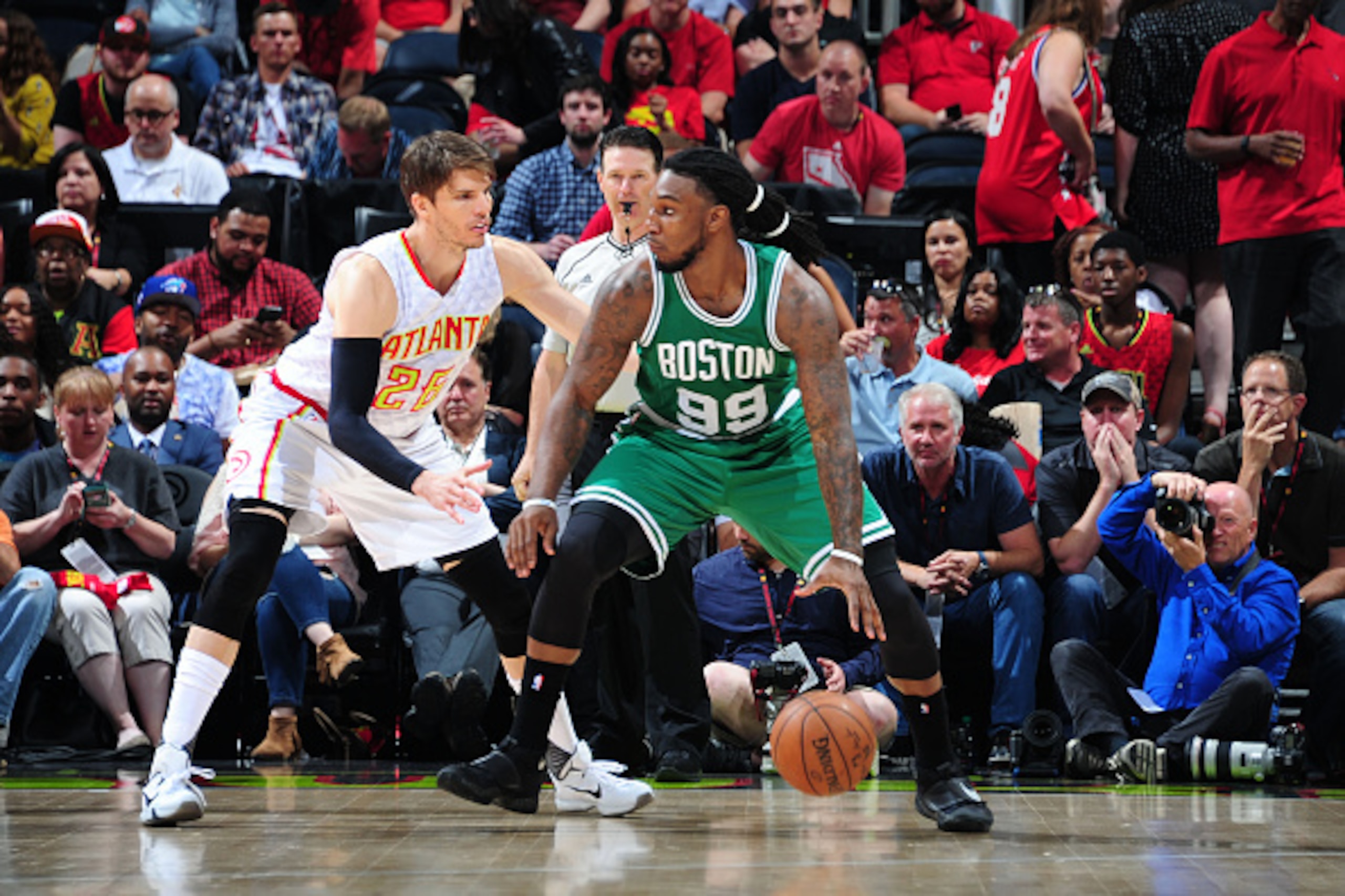 ATLANTA, GA - APRIL 26:  Jae Crowder #99 of the Boston Celtics handles the ball against Kyle Korver #26 of the Atlanta Hawks in Game Five of the Eastern Conference Quarterfinals during the 2016 NBA Playoffs on April 26, 2016 at Philips Arena in Atlanta, G