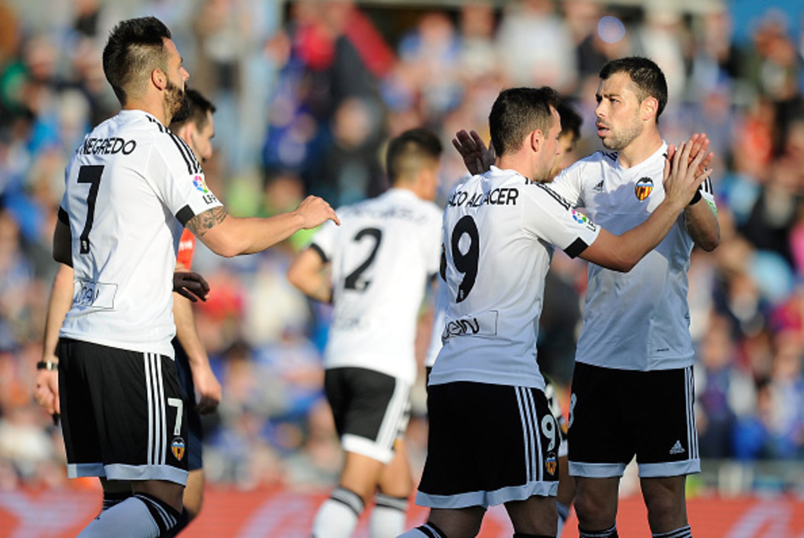 GETAFE, SPAIN - APRIL 24:  Paco Alcacer of Valencia celebrates with Alvaro Negredo (#7) and Javi Fuego after scoring his team's 2nd goal during the La Liga match between Getafe CF and Valencia CF at Coliseum Alfonso Perez on April 24, 2016 in Getafe, Spai
