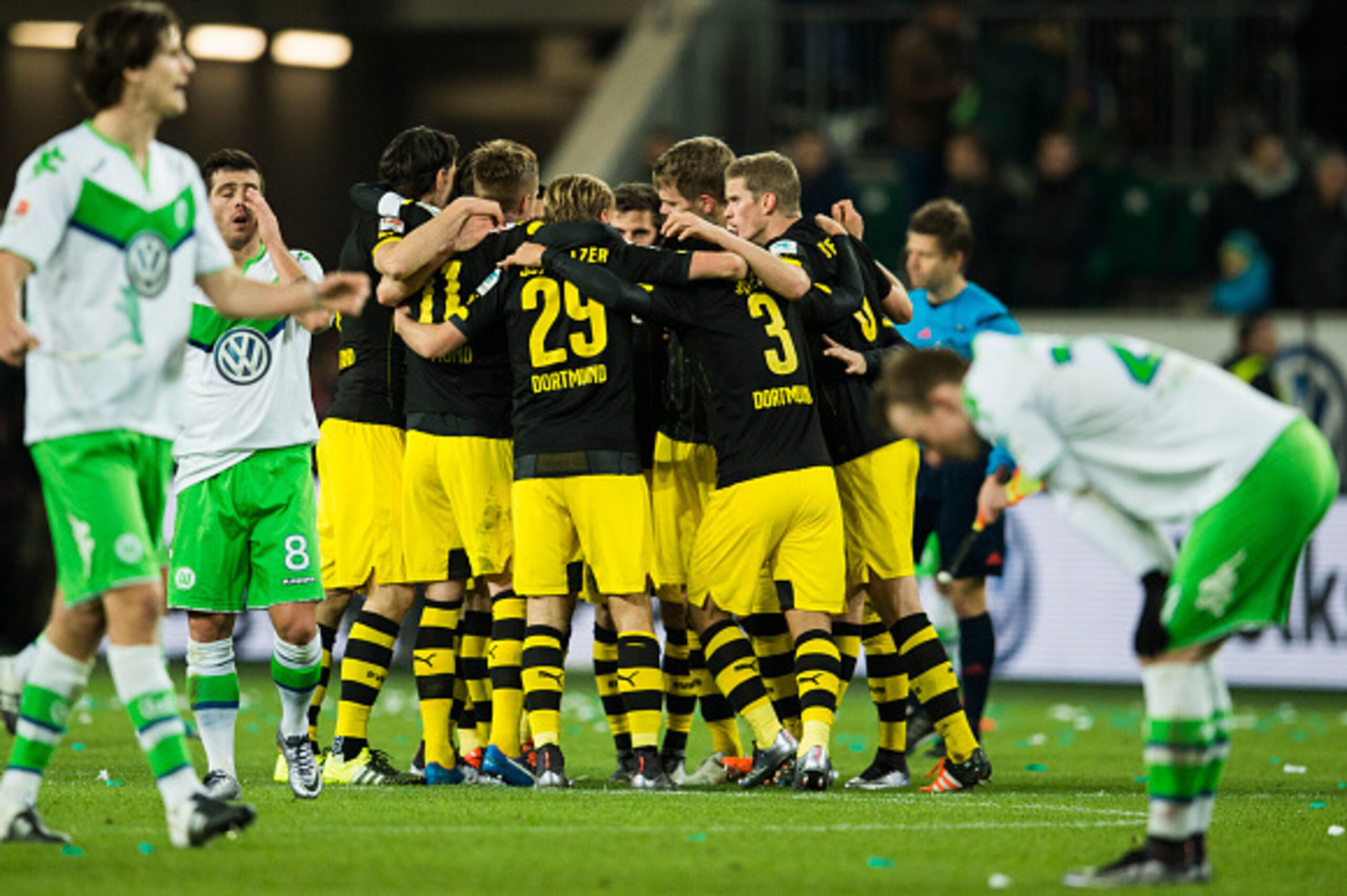 Dortmund and Wolfsburg players react at the final whistle during the German first division Bundesliga football match Wolfsburg vs Dortmund in Wolfsburg on December 5, 2015.  
AFP PHOTO / ODD ANDERSEN
RESTRICTIONS: DURING MATCH TIME: DFL RULES TO LIMIT THE