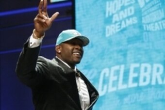 Apr 28, 2016; Chicago, IL, USA; Laremy Tunsil (Mississippi) is selected by the Miami Dolphins as the number thirteen overall pick in the first round of the 2016 NFL Draft at Auditorium Theatre. Mandatory Credit: Kamil Krzaczynski-USA TODAY Sports