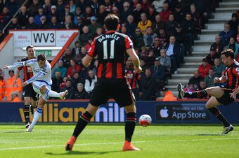 Chelsea's Belgian midfielder Eden Hazard (L) shoots to score their second goal during the English Premier League football match between Bournemouth and Chelsea at the Vitality Stadium in Bournemouth, southern England on April 23, 2016. / AFP / GLYN KIRK /