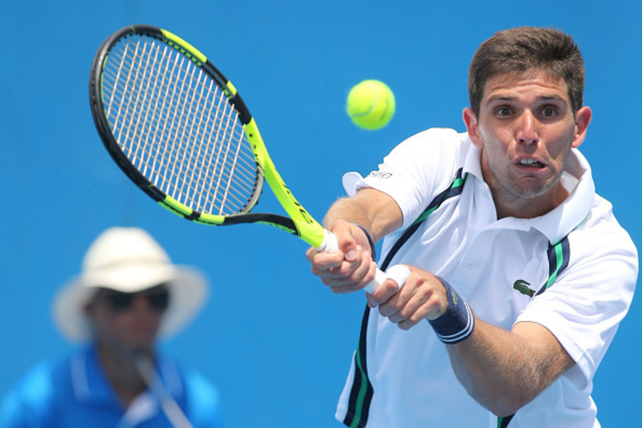 MELBOURNE, AUSTRALIA - JANUARY 18:  Federico Delbonis of Argentina plays a backhand in his first round match against Ivo Karlovic of Croatia during day one of the 2016 Australian Open at Melbourne Park on January 18, 2016 in Melbourne, Australia.  (Photo 