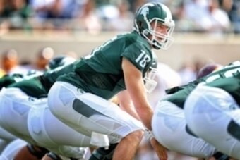 Sep 26, 2015; East Lansing, MI, USA; Michigan State Spartans quarterback Connor Cook (18) prepares to take the snap of the ball during the 1st quarter of a game at Spartan Stadium. Mandatory Credit: Mike Carter-USA TODAY Sports