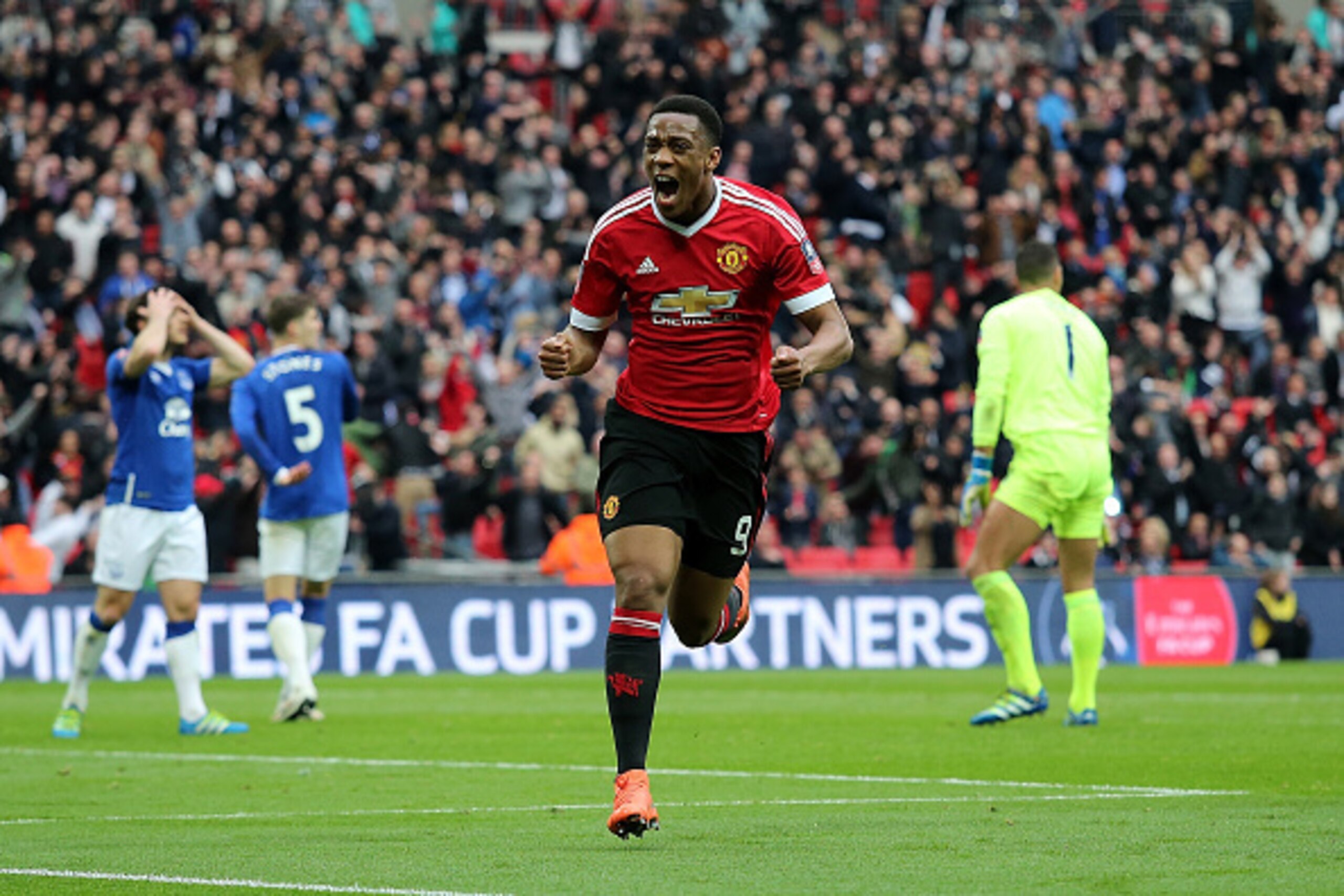 LONDON, ENGLAND - APRIL 23:  Anthony Martial of Manchester United celebrates scoring the winning goal to make the score 1-2 during the Emirates FA Cup Semi Final match between Everton and Manchester United at Wembley Stadium on April 23, 2016 in London, E