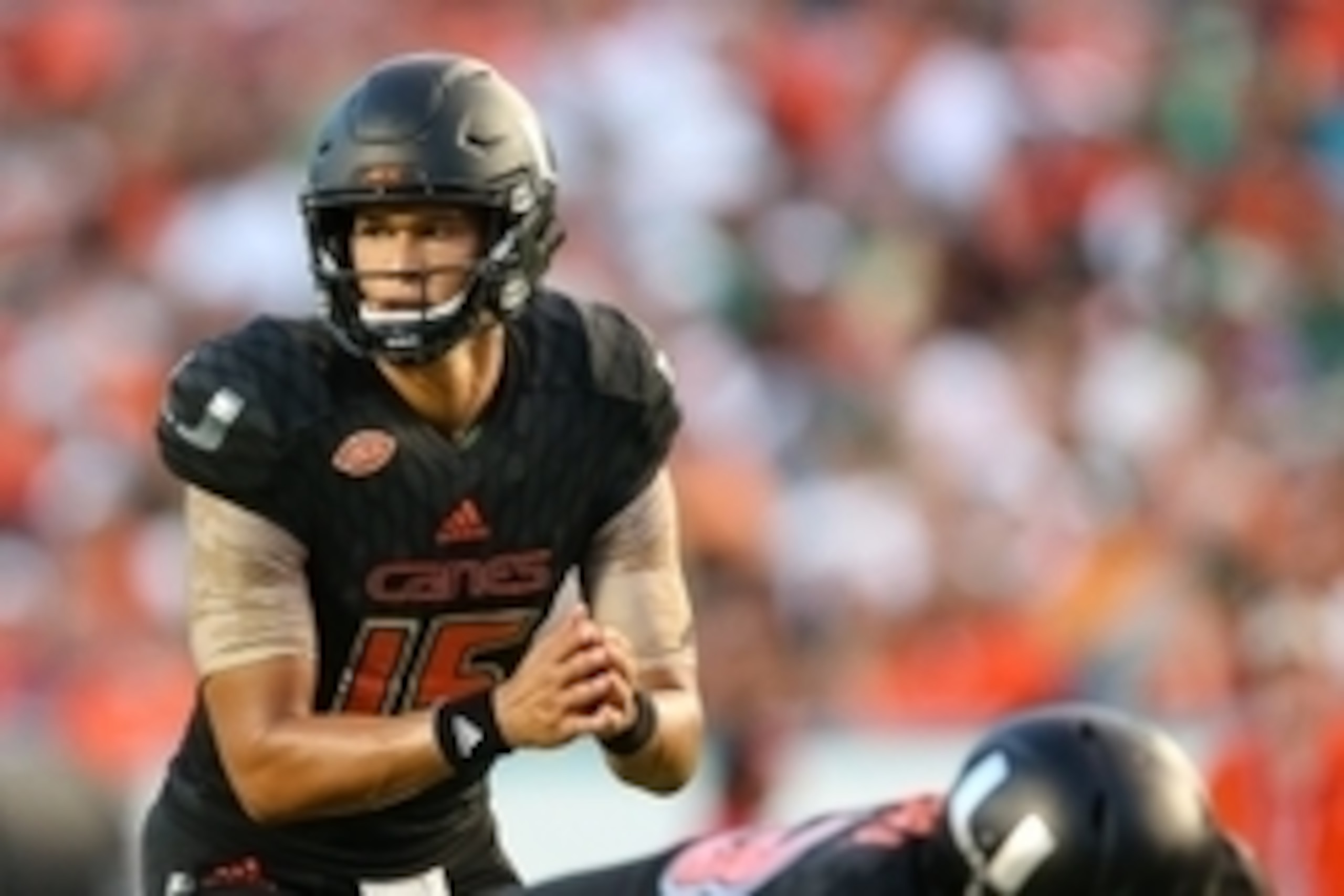 Nov 7, 2015; Miami Gardens, FL, USA; Miami Hurricanes quarterback Brad Kaaya (15) takes a snap from the line of scrimmage during the second half against the Virginia Cavaliers at Sun Life Stadium. Mandatory Credit: Steve Mitchell-USA TODAY Sports