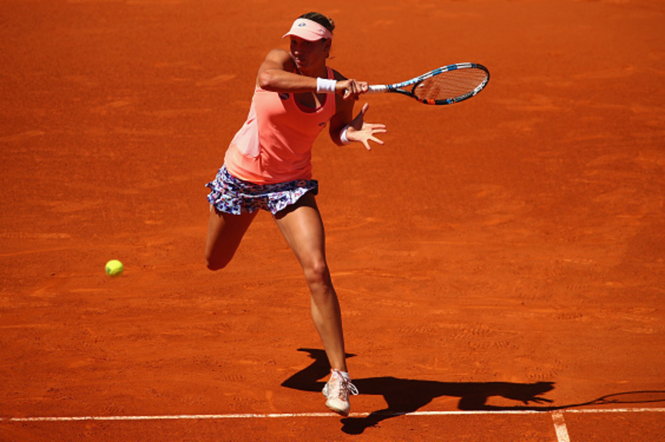 MADRID, SPAIN - APRIL 30:  Yanina Wickmayer of Belgium plays a forehand against Elina Svitolina of the Ukraine in their first round  match during day one of the Mutua Madrid Open tennis tournament at the Caja Magica on April 30, 2016 in Madrid, Spain. .  