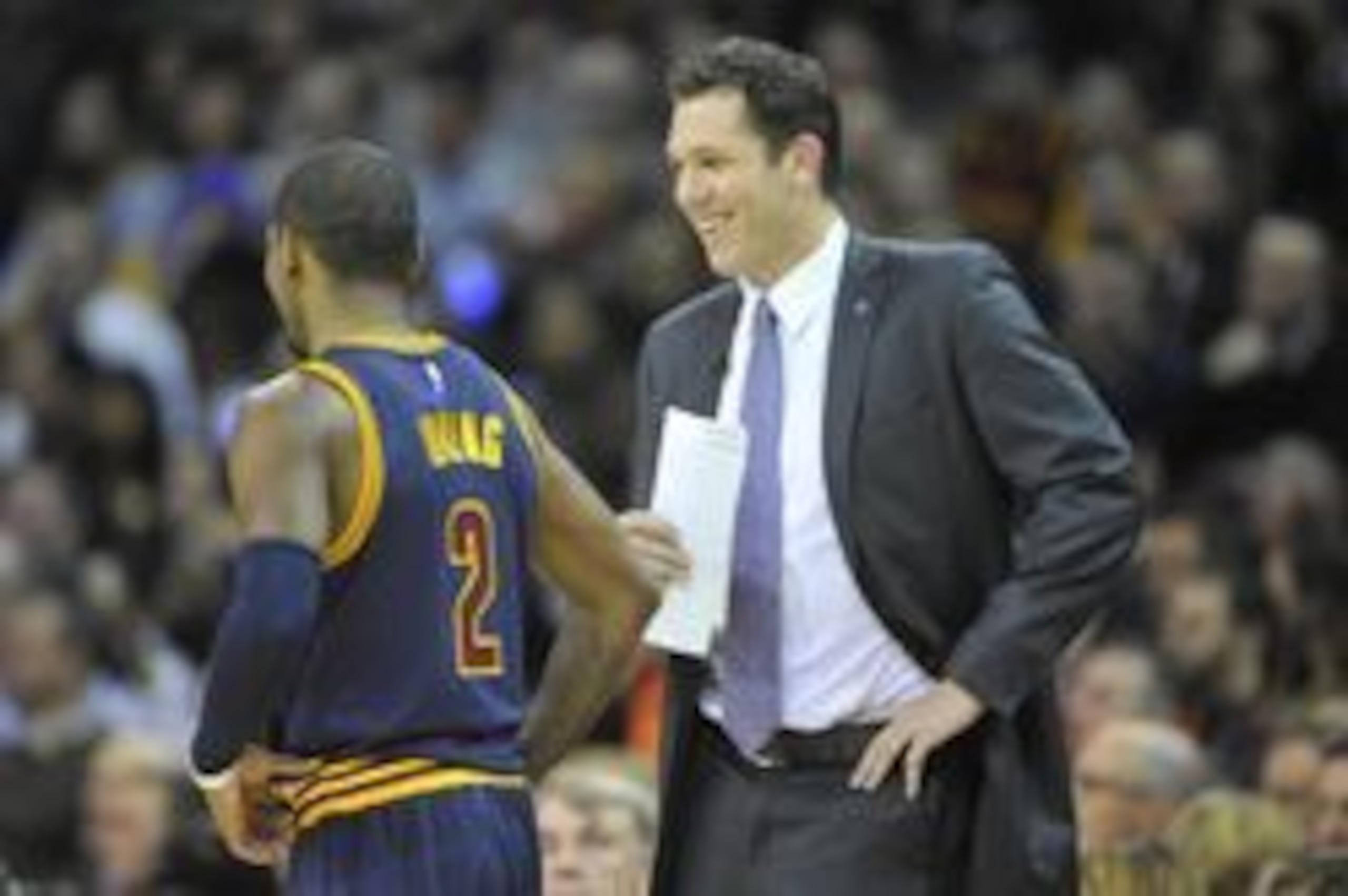 Jan 18, 2016; Cleveland, OH, USA; Golden State Warriors interim head coach Luke Walton talks to Cleveland Cavaliers guard Kyrie Irving (2) in the first quarter at Quicken Loans Arena. Mandatory Credit: David Richard-USA TODAY Sports