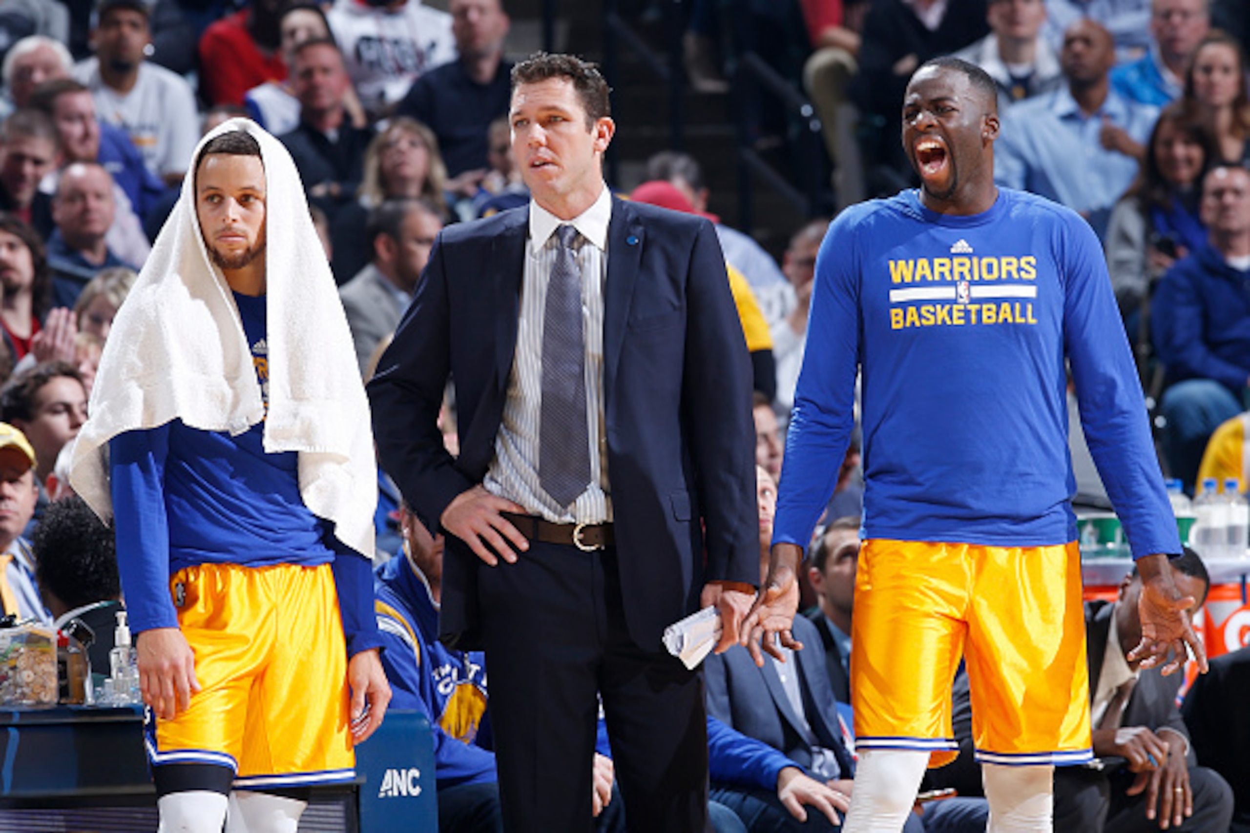 INDIANAPOLIS, IN - DECEMBER 8: Interim coach Luke Walton looks on alongside Draymond Green #23 and Stephen Curry #30 of the Golden State Warriors in the first half of the game against the Indiana Pacers at Bankers Life Fieldhouse on December 8, 2015 in In