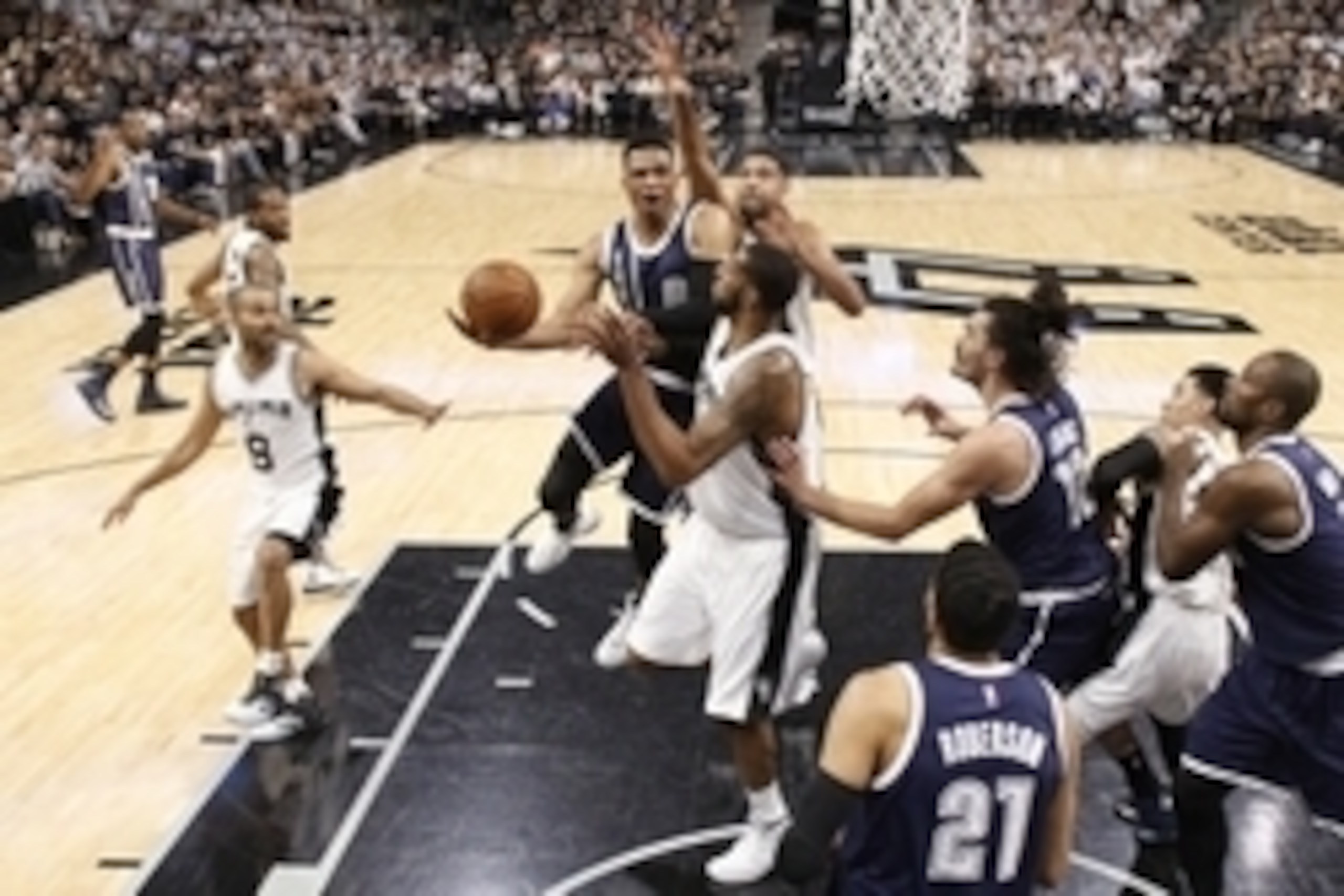 Apr 30, 2016; San Antonio, TX, USA; Oklahoma City Thunder point guard Russell Westbrook (0) shoots the ball as San Antonio Spurs power forward LaMarcus Aldridge (12, front) and Tim Duncan (21, behind) defend in game one of the second round of the NBA Play